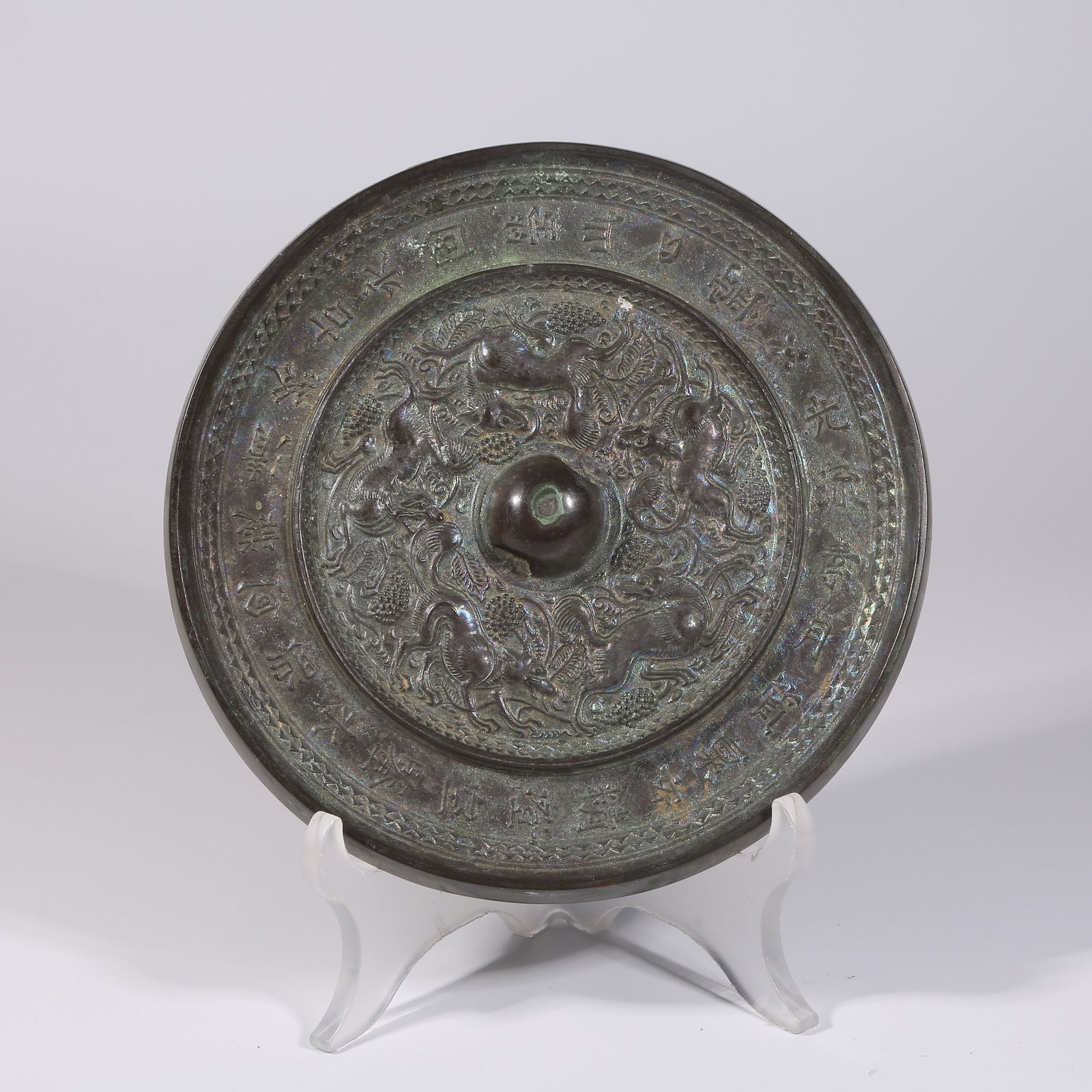 A PRE-HAN BRONZE MIRROR WITH AUSPICIOUS BEAST MOTIFS AND INSCRIPTIONS (1 of 9)