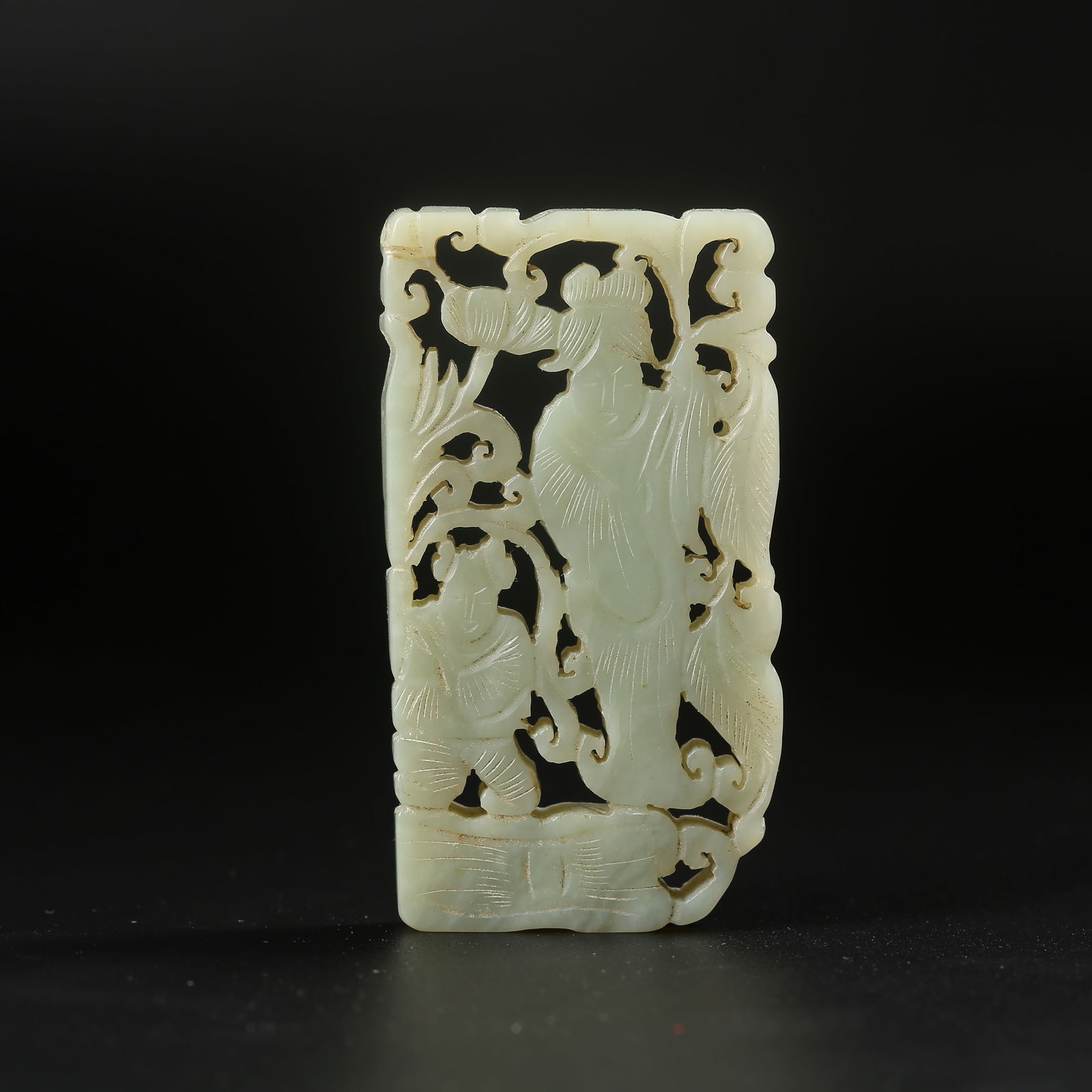 A HETIAN JADE PLAQUE CARVED WITH A CHILD HOLDING A LOTUS (1 of 8)