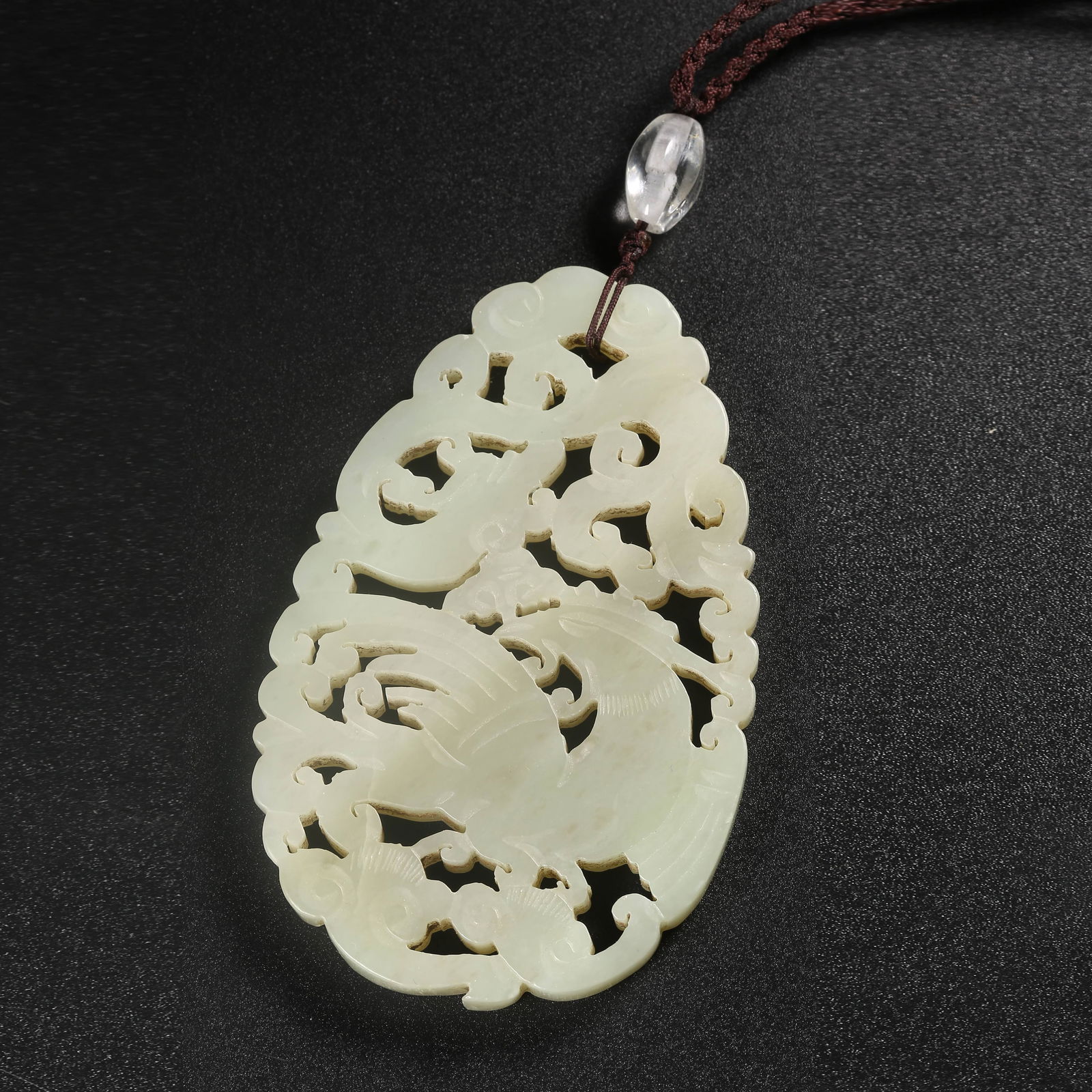 A HETIAN JADE PENDANT CARVED WITH DIVINE PHOENIX MOTIFS (1 of 8)