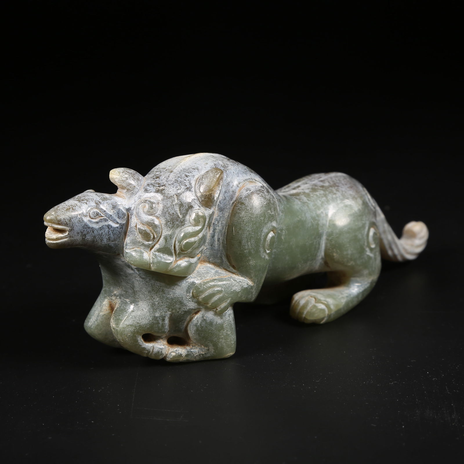 A ARCHAIC JADE ORNAMENT OF A TIGER POUNCING ON A BEAST (1 of 8)