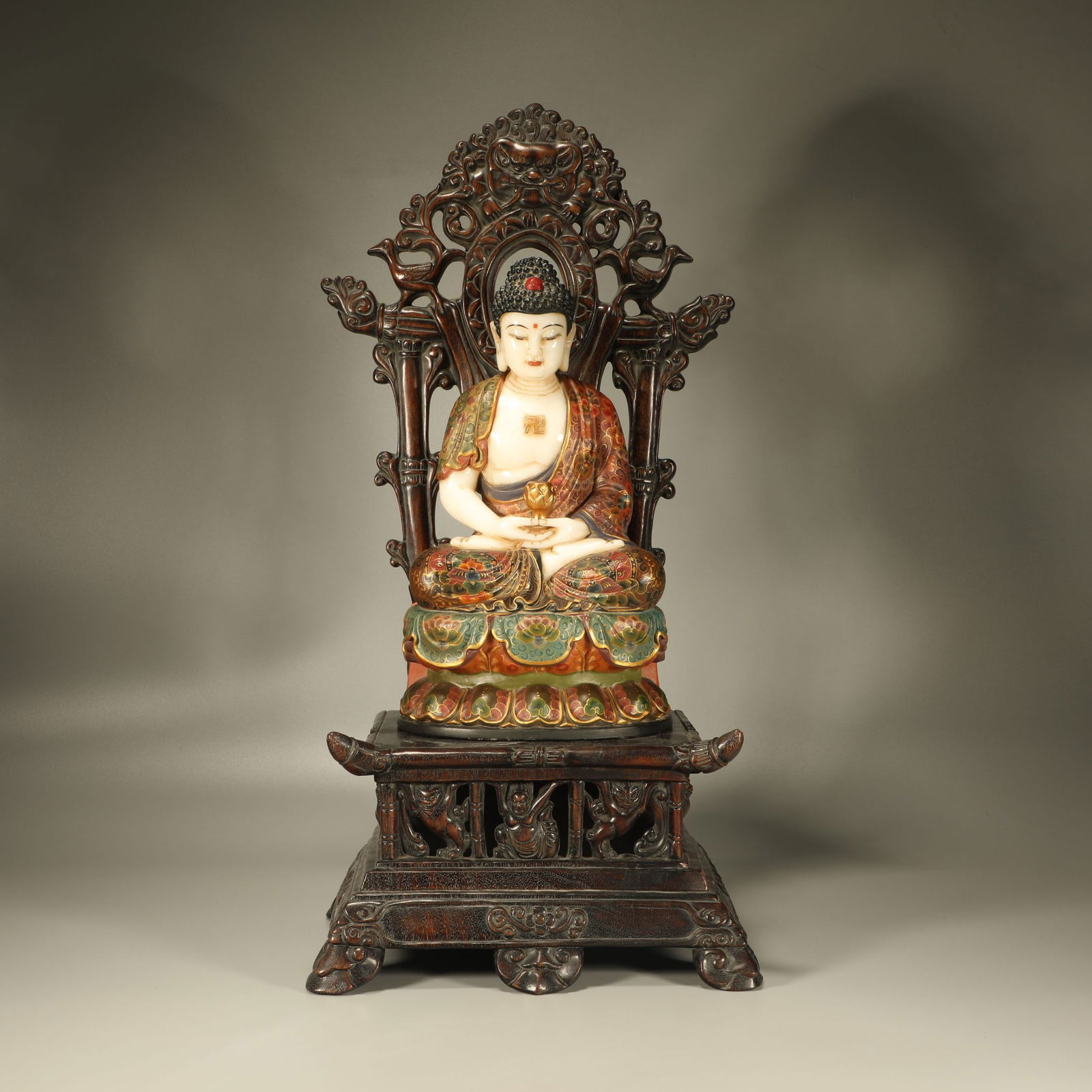 A PAINTED WHITE JADE SEATED STATUE OF SHAKYAMUNI BUDDHA (1 of 7)