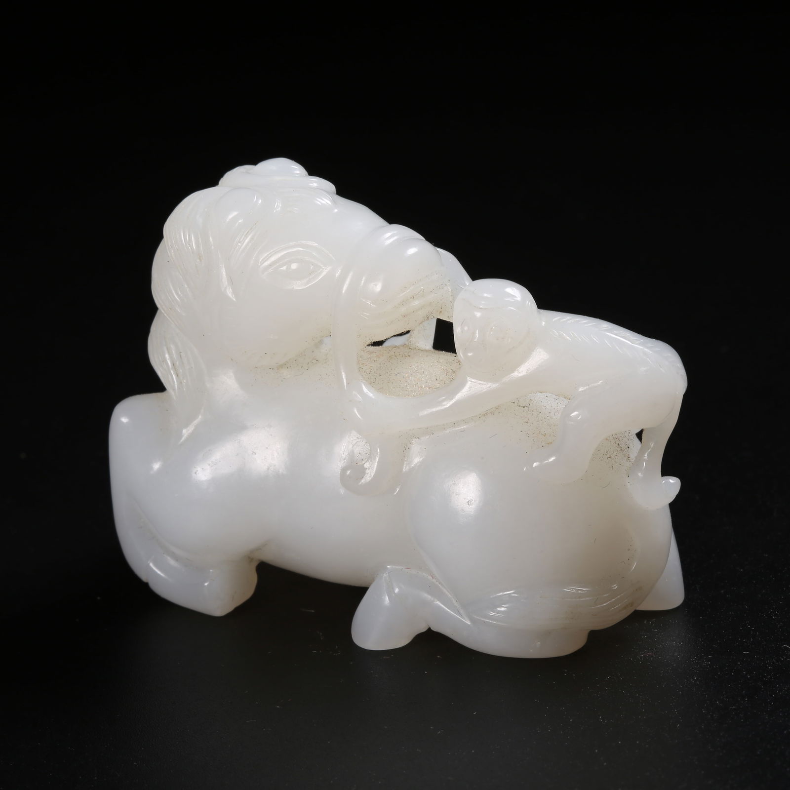 A HETIAN JADE ORNAMENT OF A MOUNTED GENERAL BEING ENNOBLED (1 of 8)