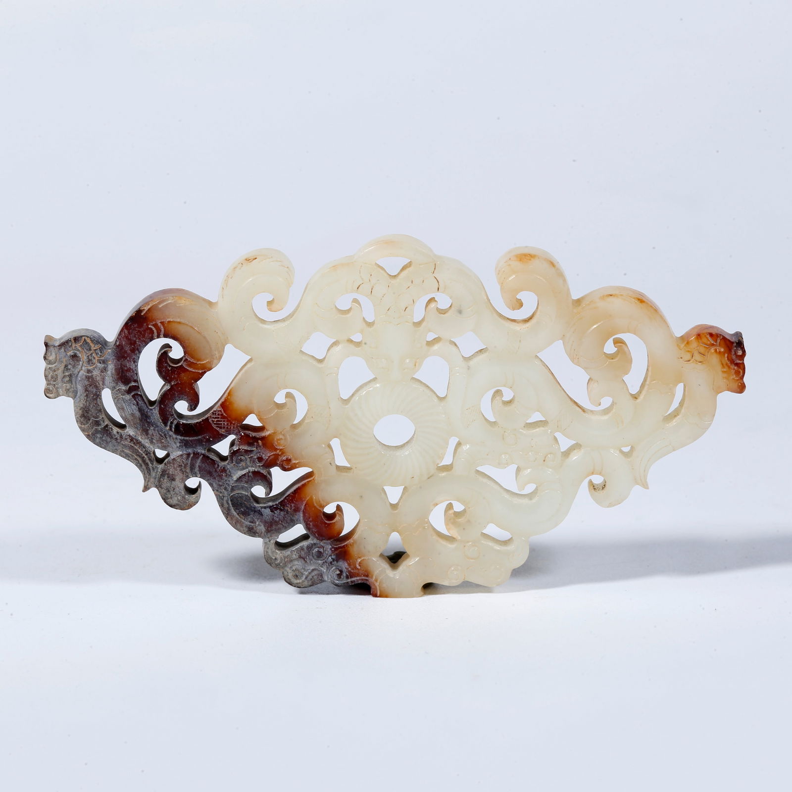 A HETIAN JADE PENDANT CARVED IN THE SHAPE OF AN AUSPICIOUS BEAST (1 of 9)
