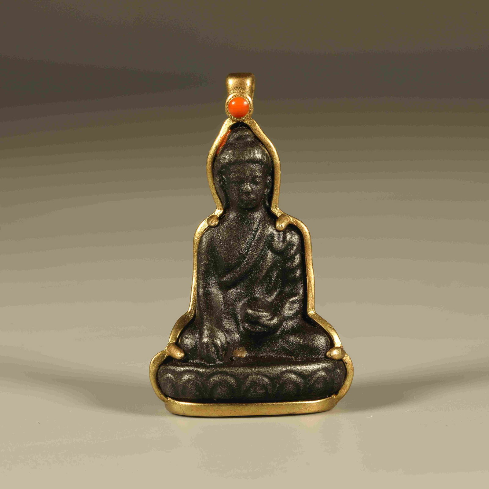 A IRON SEATED BUDDHA PENDANT (1 of 6)