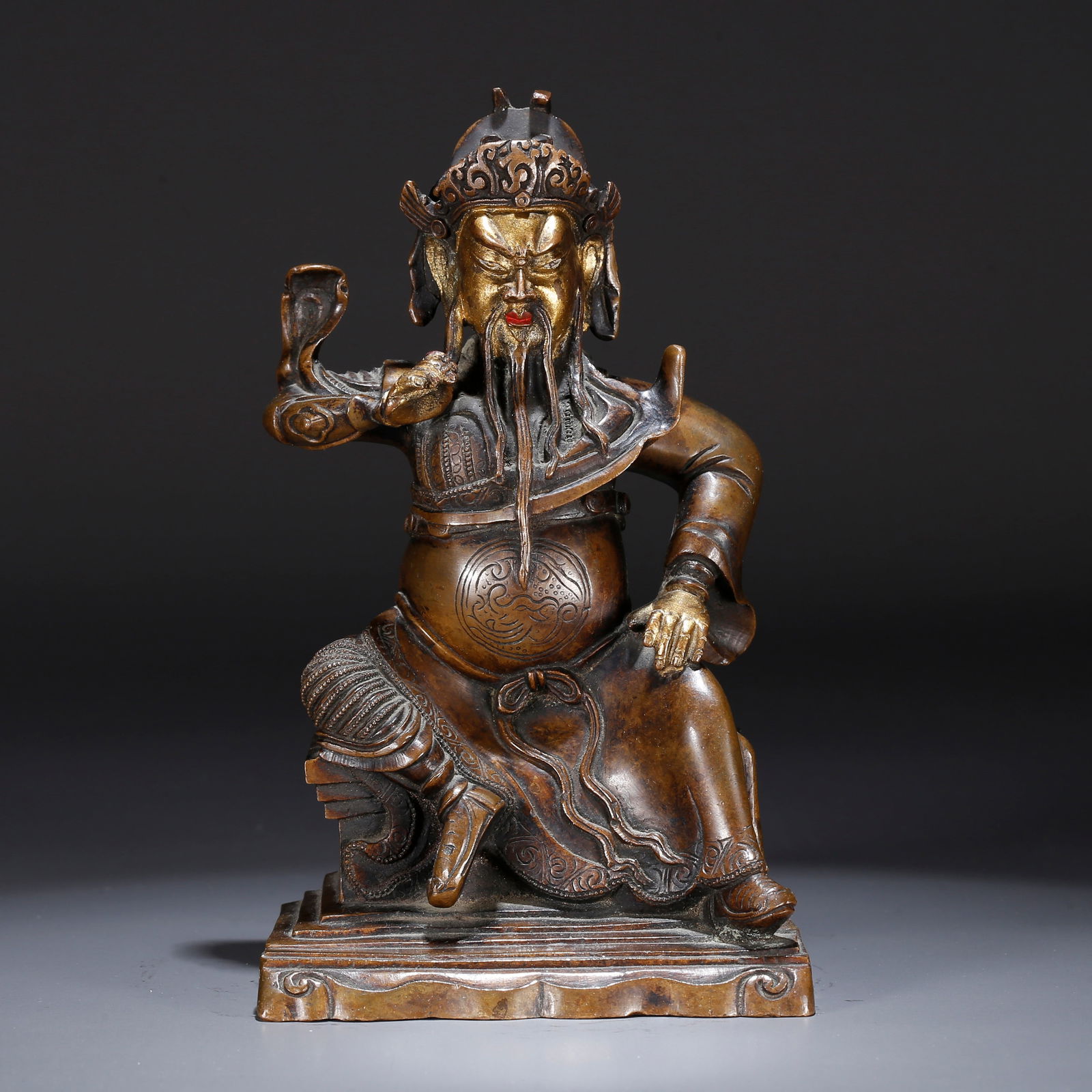 A BRONZE PARTIALLY GILT STATUE OF GUAN GONG (1 of 9)