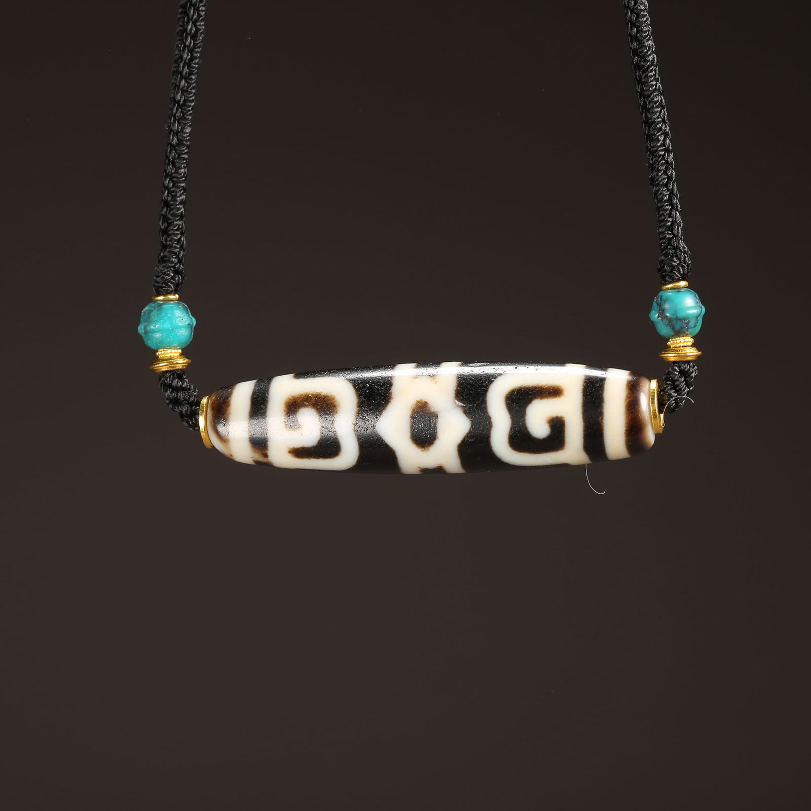 A STRAND OF AGATE DZI BEAD (1 of 8)