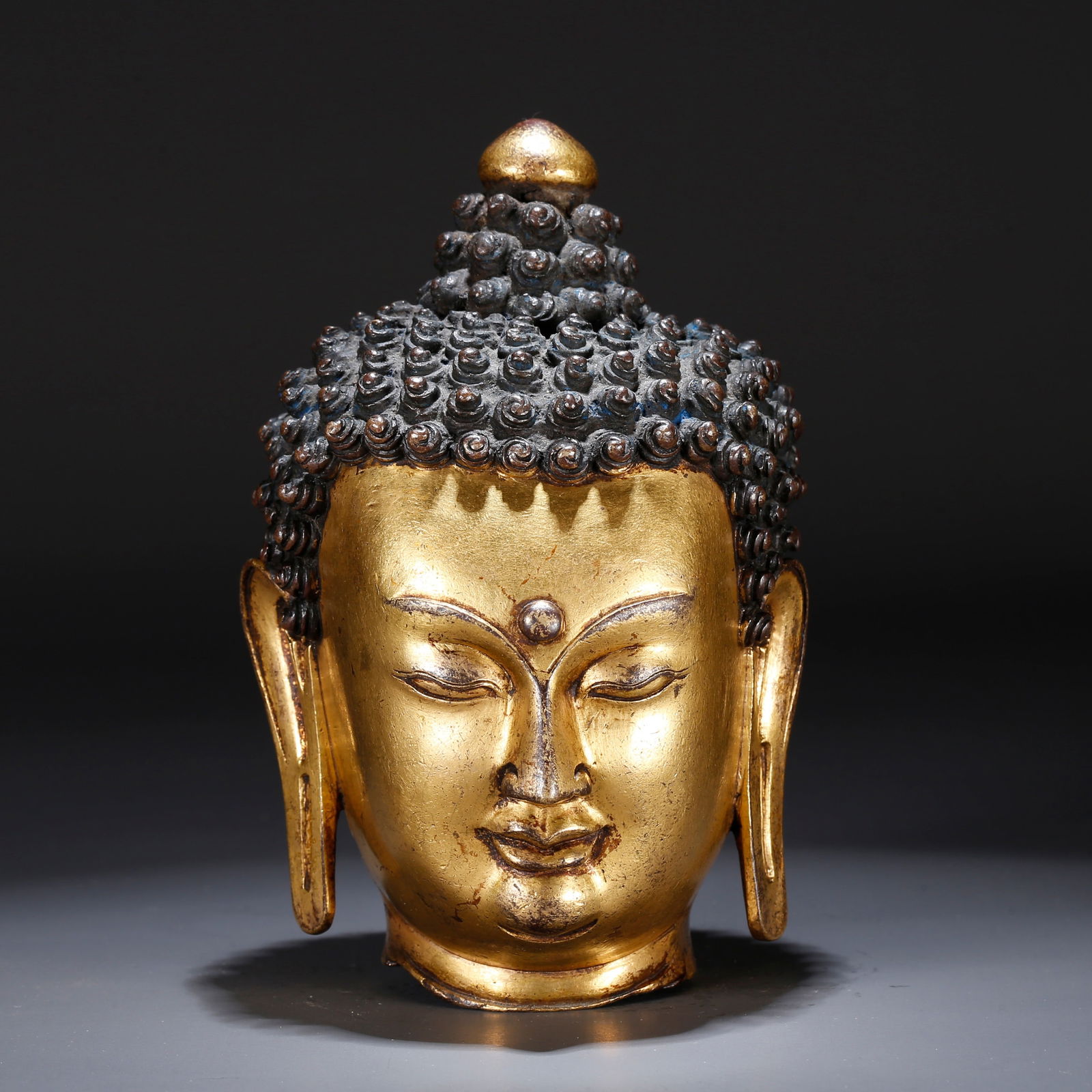 A GILT BRONZE BUDDHA HEAD (1 of 9)