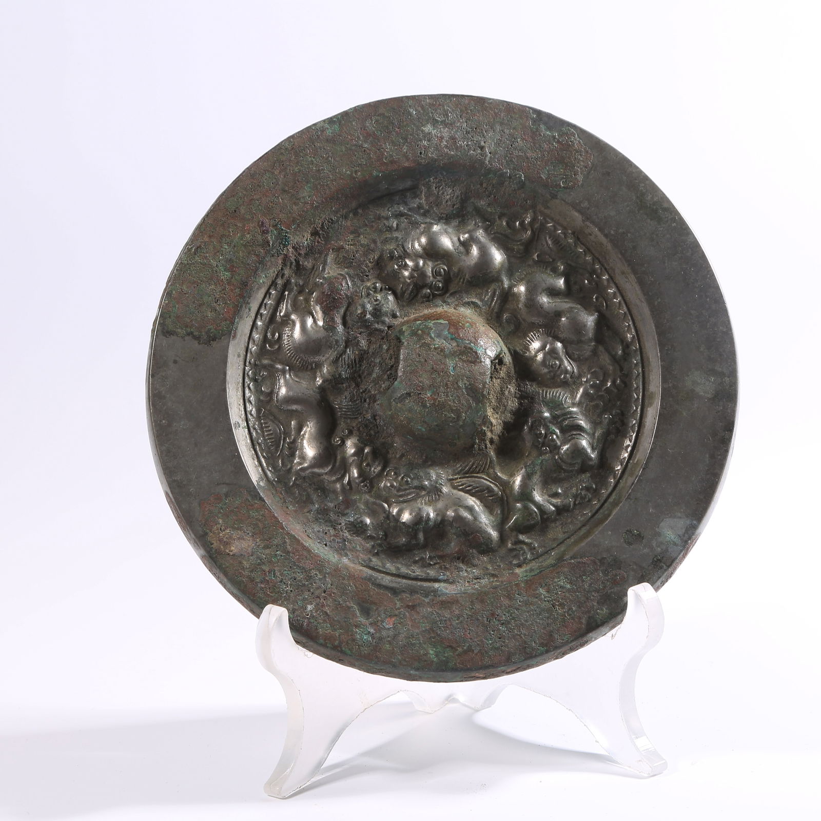 A PRE-HAN BRONZE MIRROR WITH AUSPICIOUS BEAST MOTIFS (1 of 9)