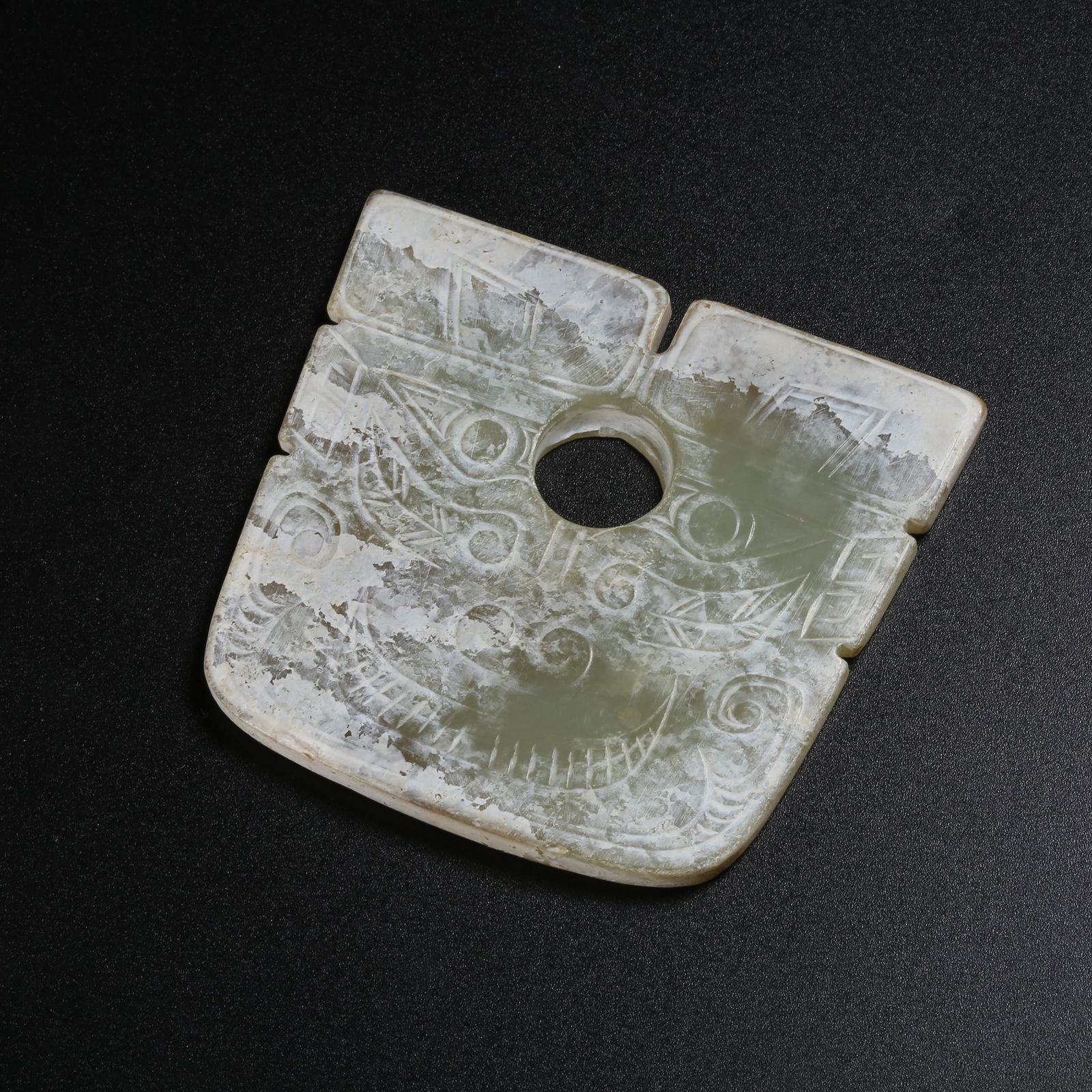 A ARCHAIC JADE BEAST-FACE PENDANT (1 of 9)