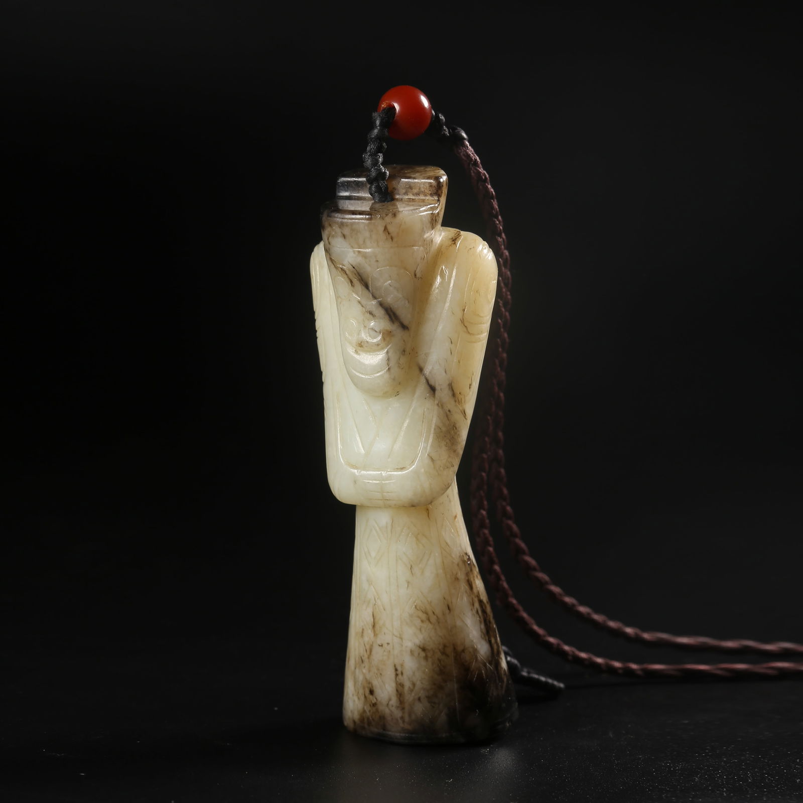A ARCHAIC JADE WENGZHONG FIGURE PENDANT (1 of 9)