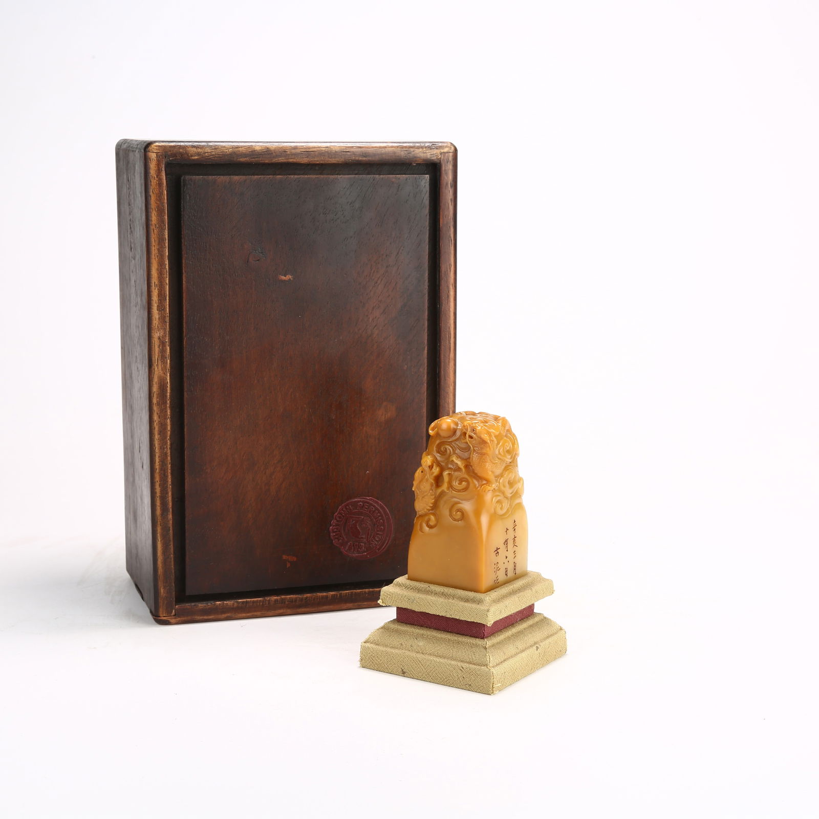 A SHOUSHAN TIANHUANG STONE SEAL WITH CLOUD AND DRAGON MOTIF: Shoushan Tianhuang Stone Seal with Cloud and Dragon Motif