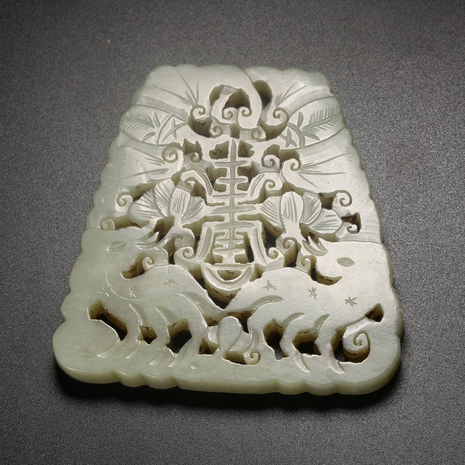 A HETIAN JADE PLAQUE CARVED WITH AUSPICIOUS BEAST MOTIFS (1 of 9)