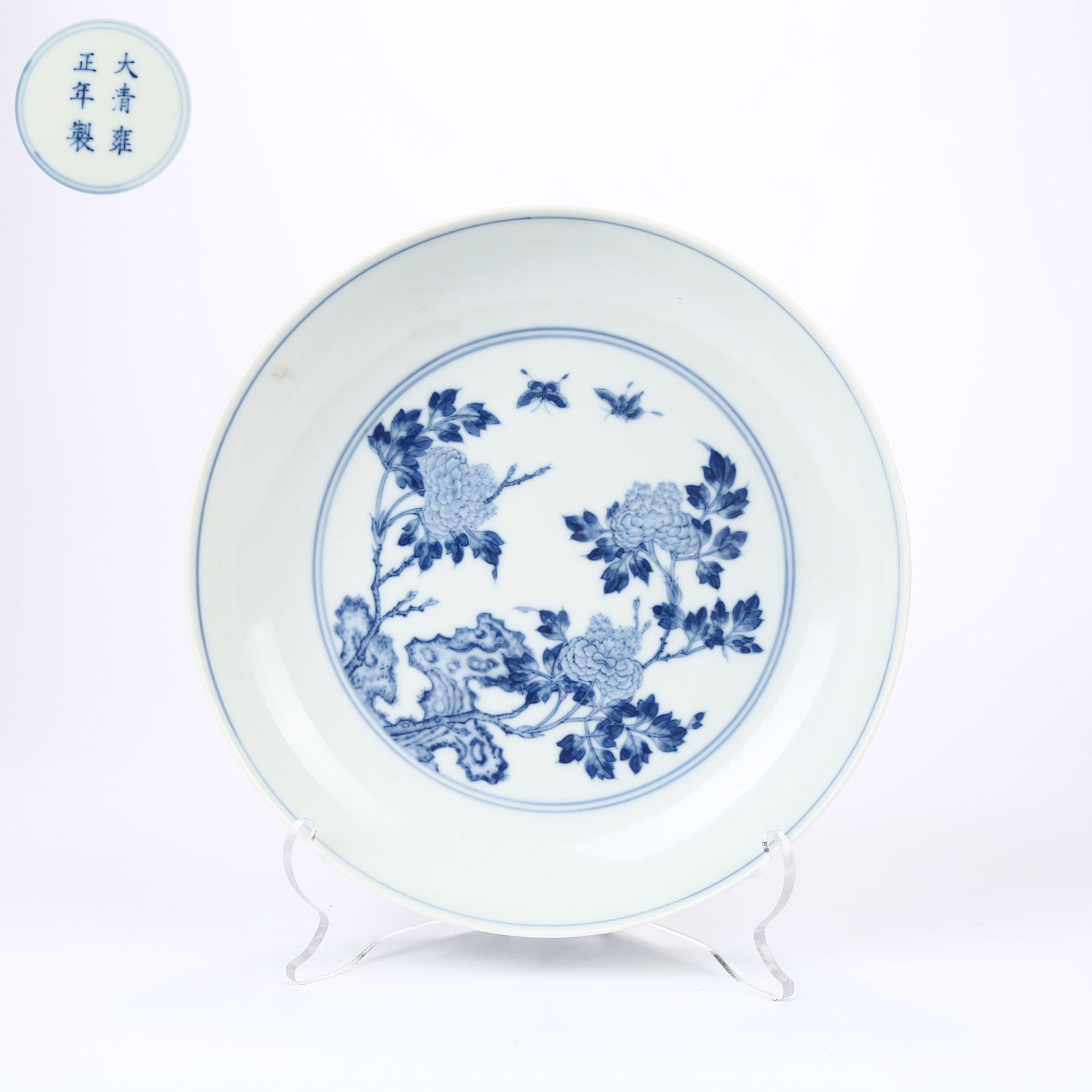 A BLUE AND WHITE DISH WITH ROCK AND FLORAL MOTIF (1 of 7)