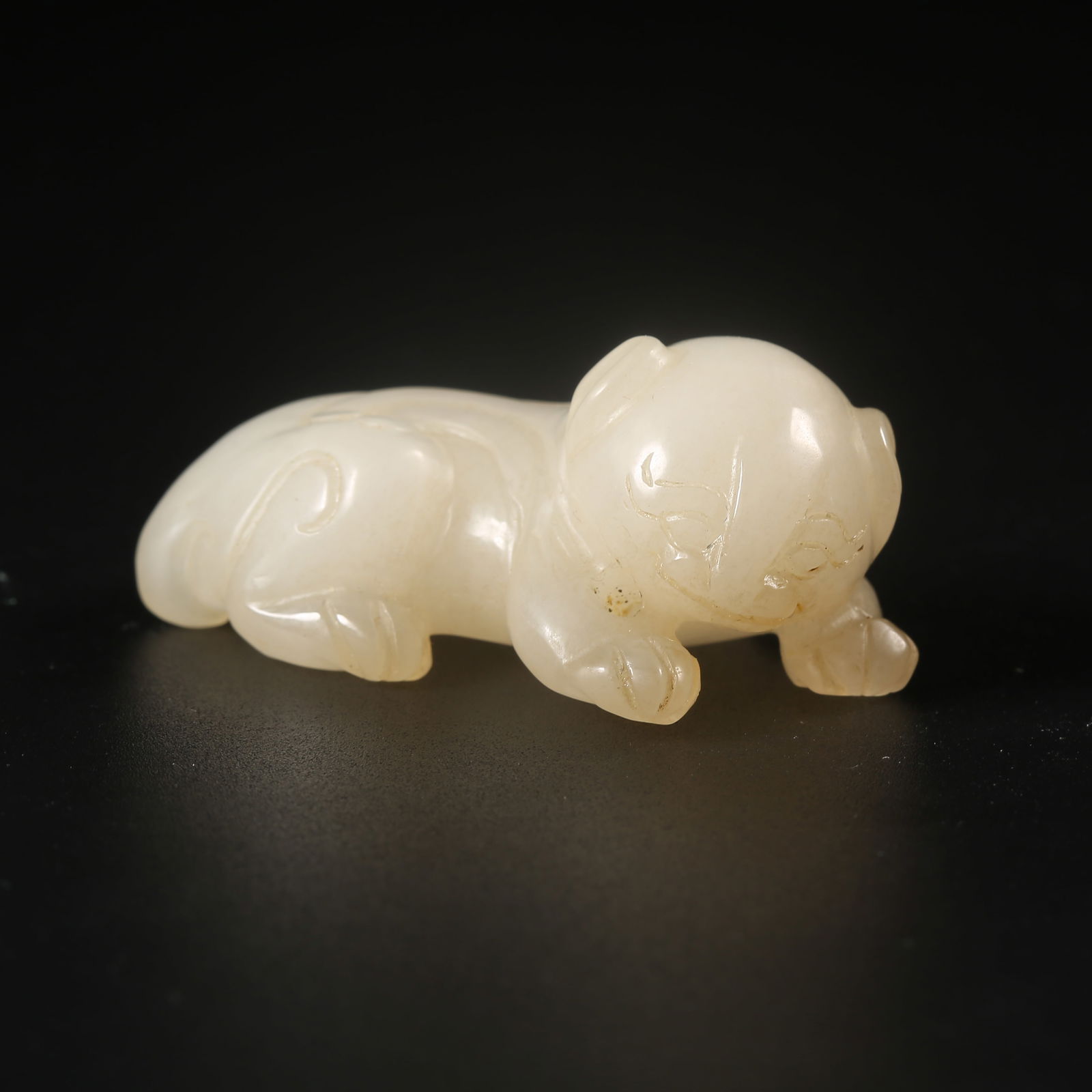 A HETIAN JADE ORNAMENT CARVED WITH AUSPICIOUS BEAST MOTIFS (1 of 8)