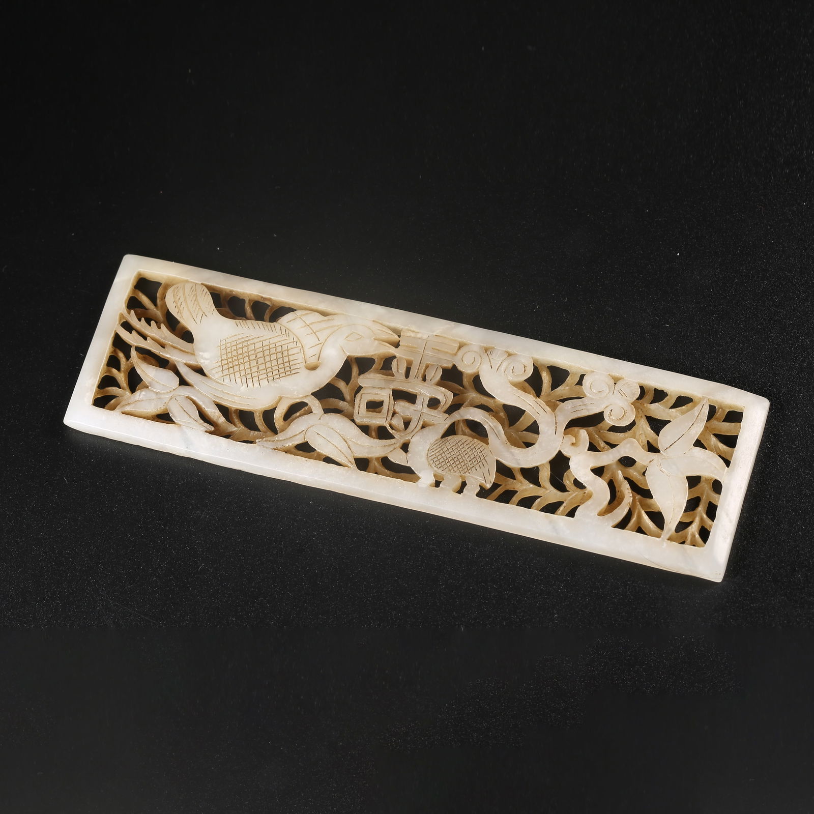 A HETIAN JADE DECORATIVE PANEL CARVED WITH A PHOENIX AMID FLOWERS (1 of 9)