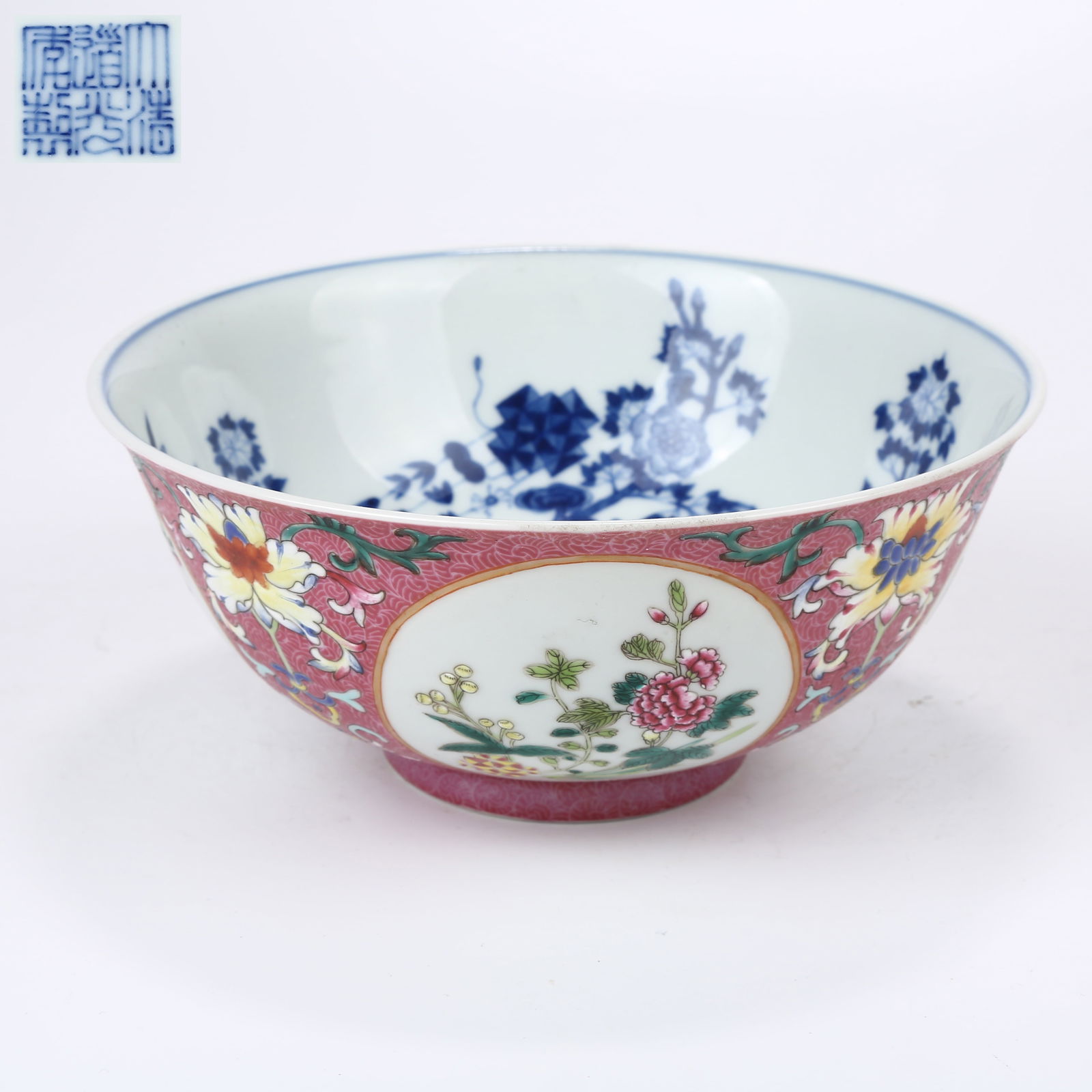A SET OF ROUGE-RED GROUND RETICULATED FAMILLE ROSE BOWLS WITH FLOWER AND FRUIT BRANCHES (1 of 10)