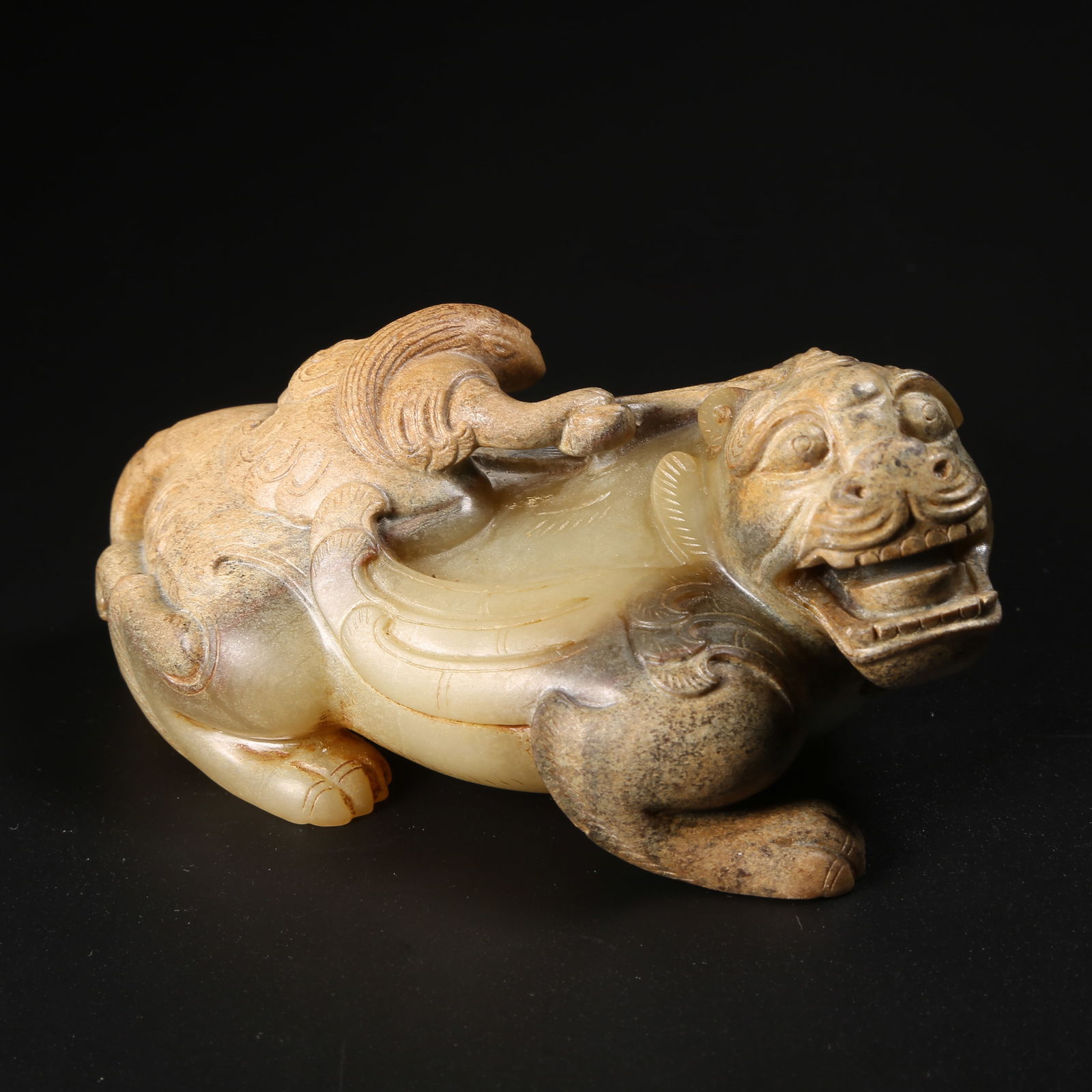 A ARCHAIC JADE FEATHERED IMMORTAL RIDING A BEAST (1 of 8)