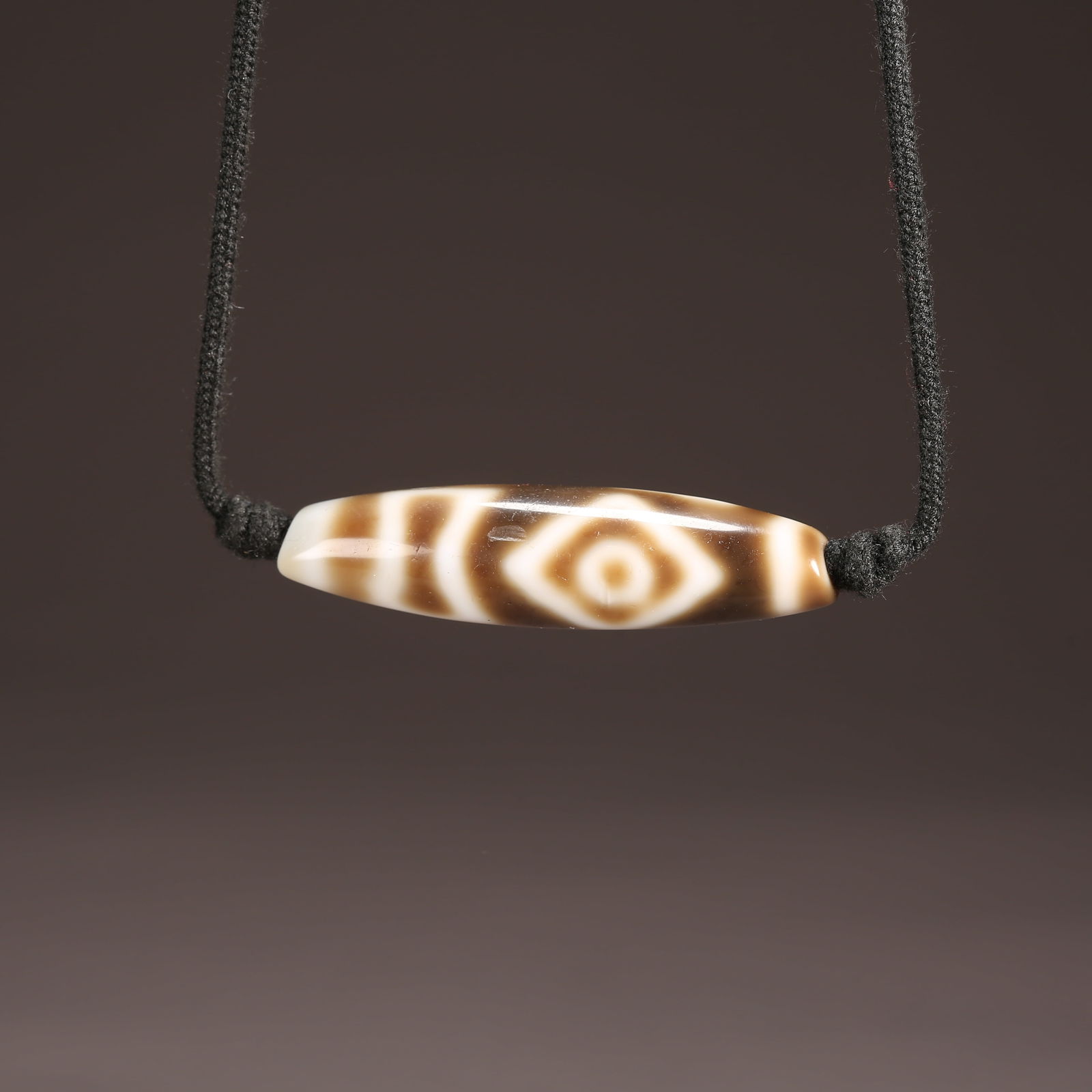 A STRAND OF AGATE DZI BEAD (1 of 8)