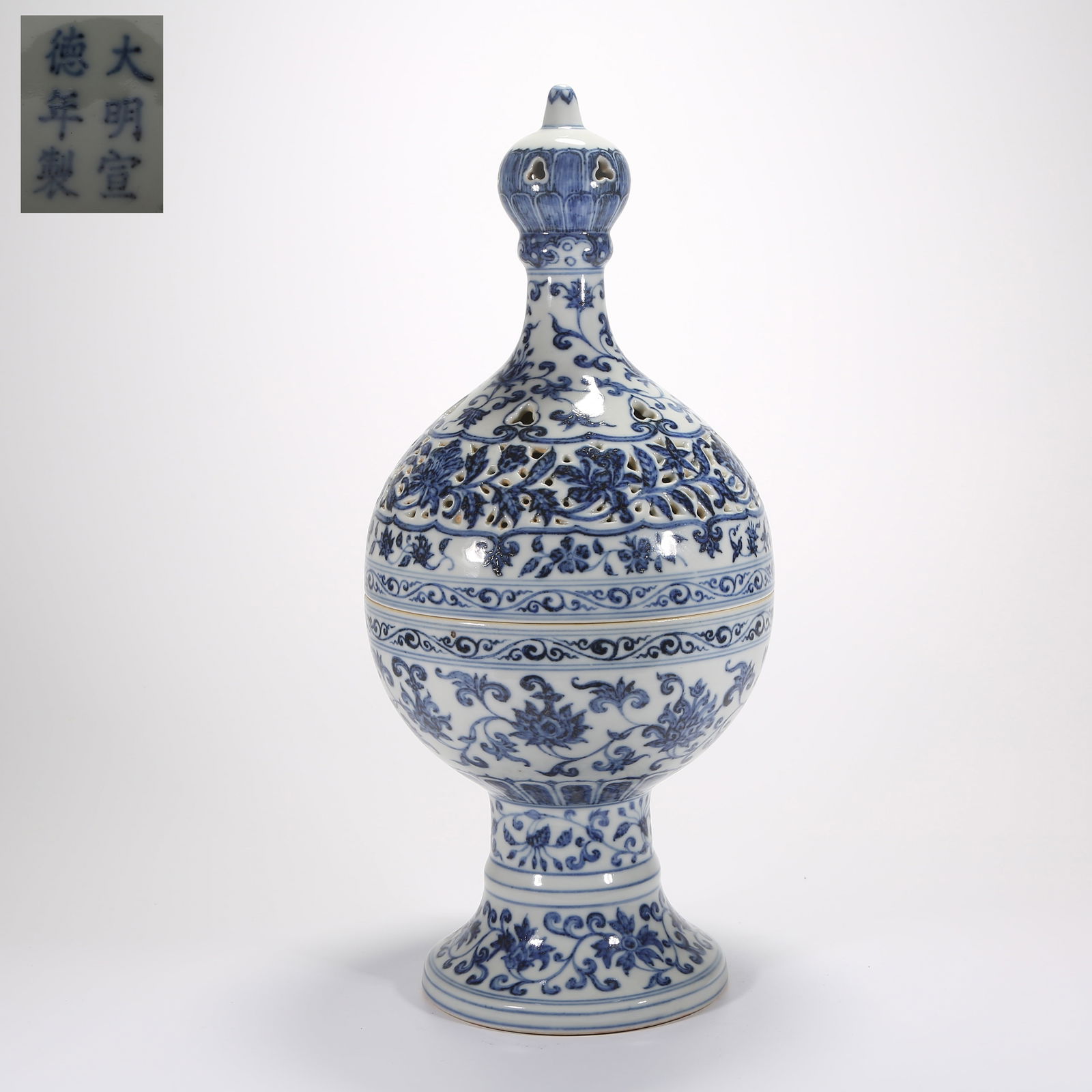 A BLUE-AND-WHITE OPENWORK INCENSE BURNER WITH SCROLLING FLORAL DESIGN (1 of 9)