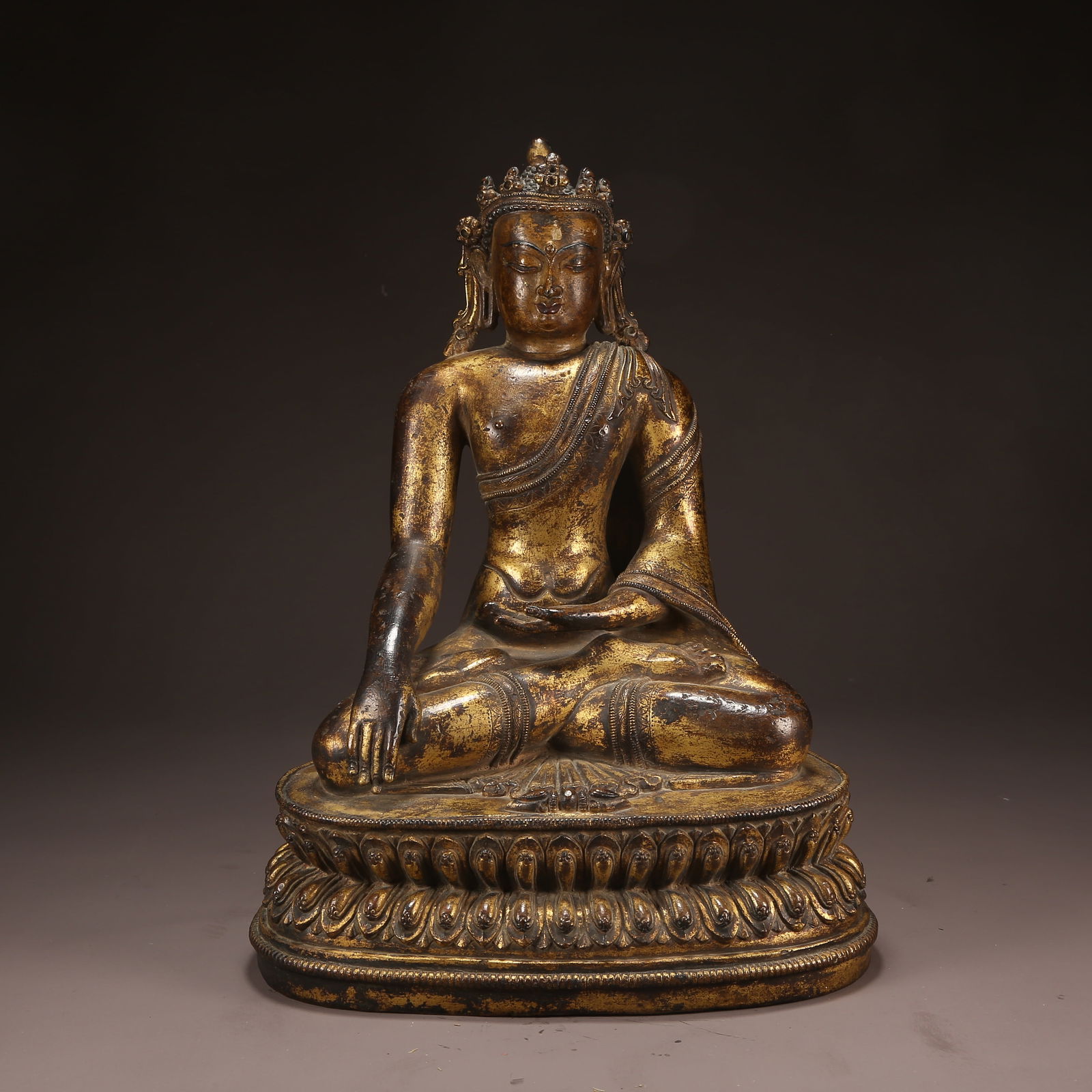 A GILT BRONZE SHAKYAMUNI WITH PRECIOUS CROWN: Gilt Bronze Shakyamuni with Precious Crown