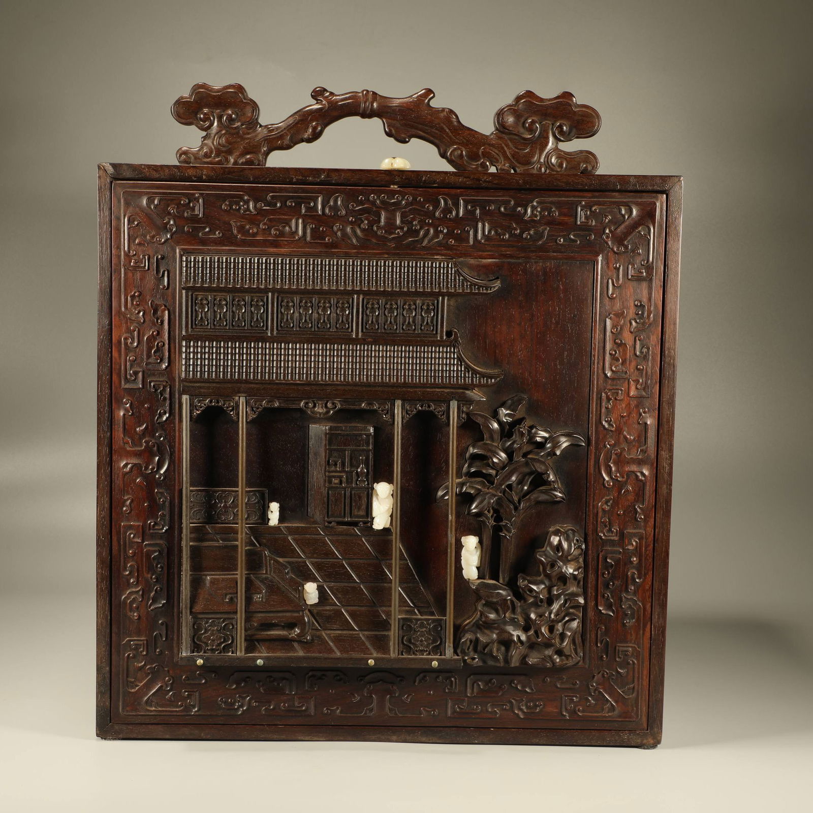 A HUANGHUALI INLAID ZITAN, JADE, AND BRONZE PAVILION, FIGURE, AND LONGEVITY PATTERN SCHOLAR’S: Huanghuali Inlaid Zitan, Jade, and Bronze Pavilion, Figure, and Longevity Pattern Scholar’s Carrying Box