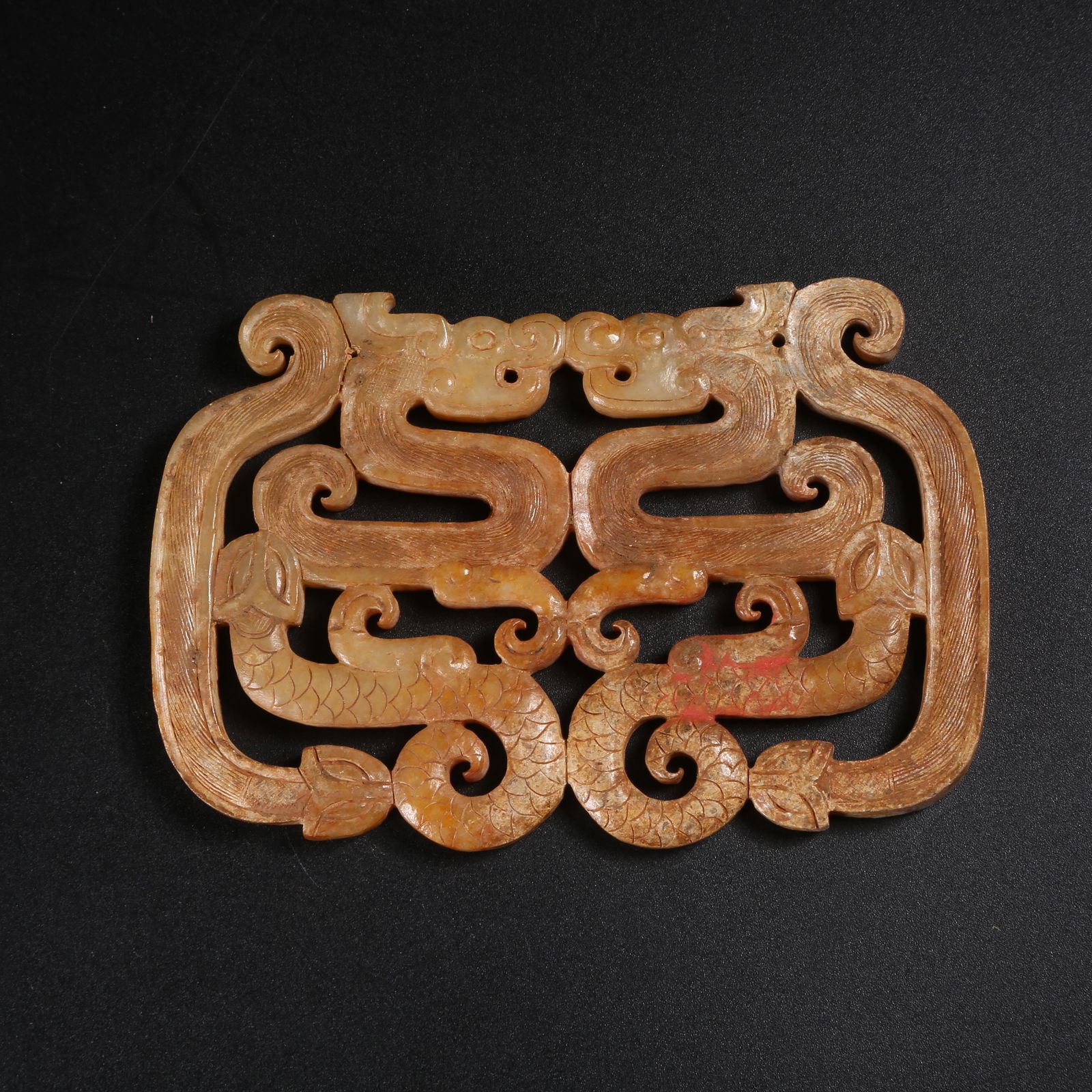 A ARCHAIC JADE FOUR-DRAGON PENDANT (1 of 8)