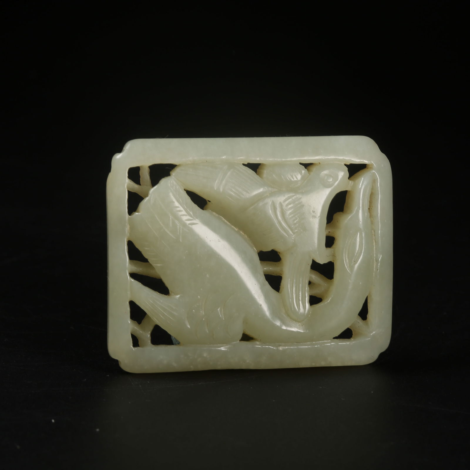 A HETIAN JADE BELT ORNAMENT WITH HAIDONGQING ATTACKING A WILD GOOSE MOTIF: Hetian Jade Belt Ornament with Haidongqing Attacking a Wild Goose Motif