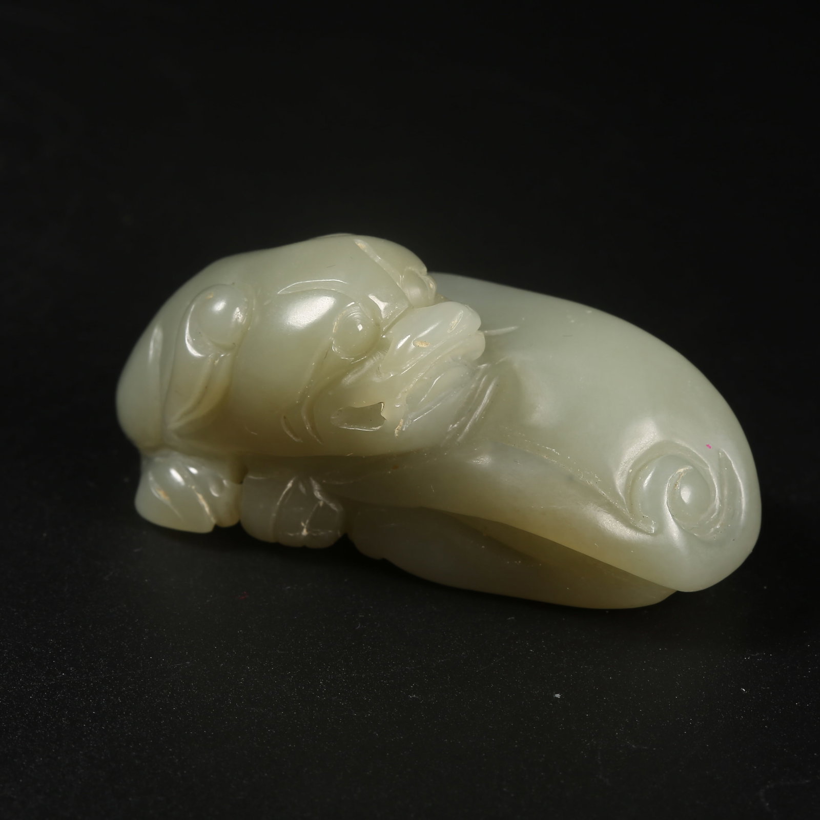 A HETIAN JADE AUSPICIOUS BEAST HAND-CARVED PIECE (1 of 8)