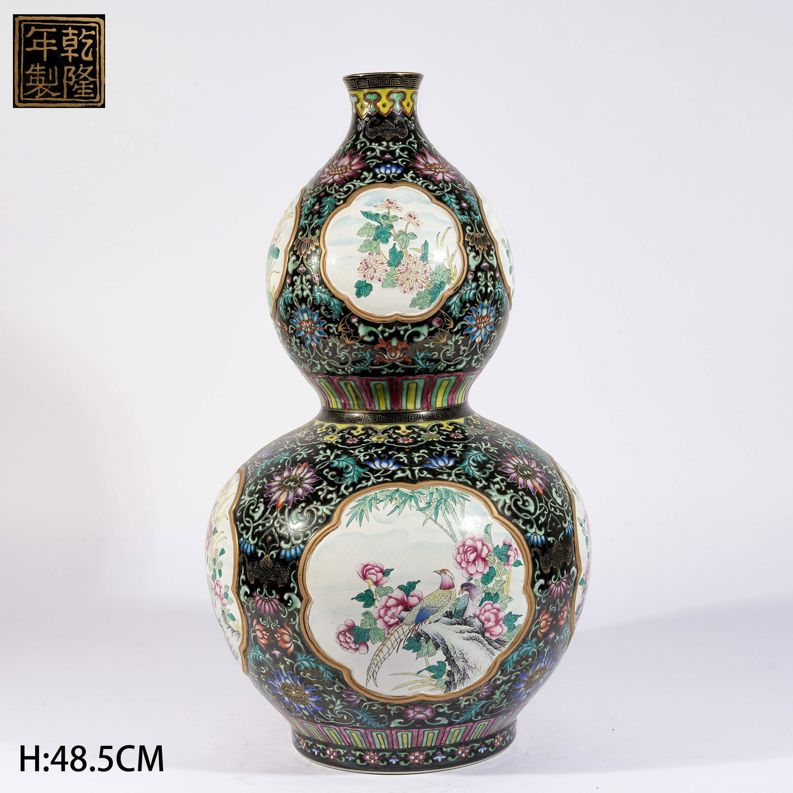 A BLACK-GOLD GROUND OPEN-WINDOW FAMILLE ROSE GOURD VASE WITH FLOWER-AND-BIRD MOTIF: Black-Gold Ground Open-Window Famille Rose Gourd Vase with Flower-and-Bird Motif