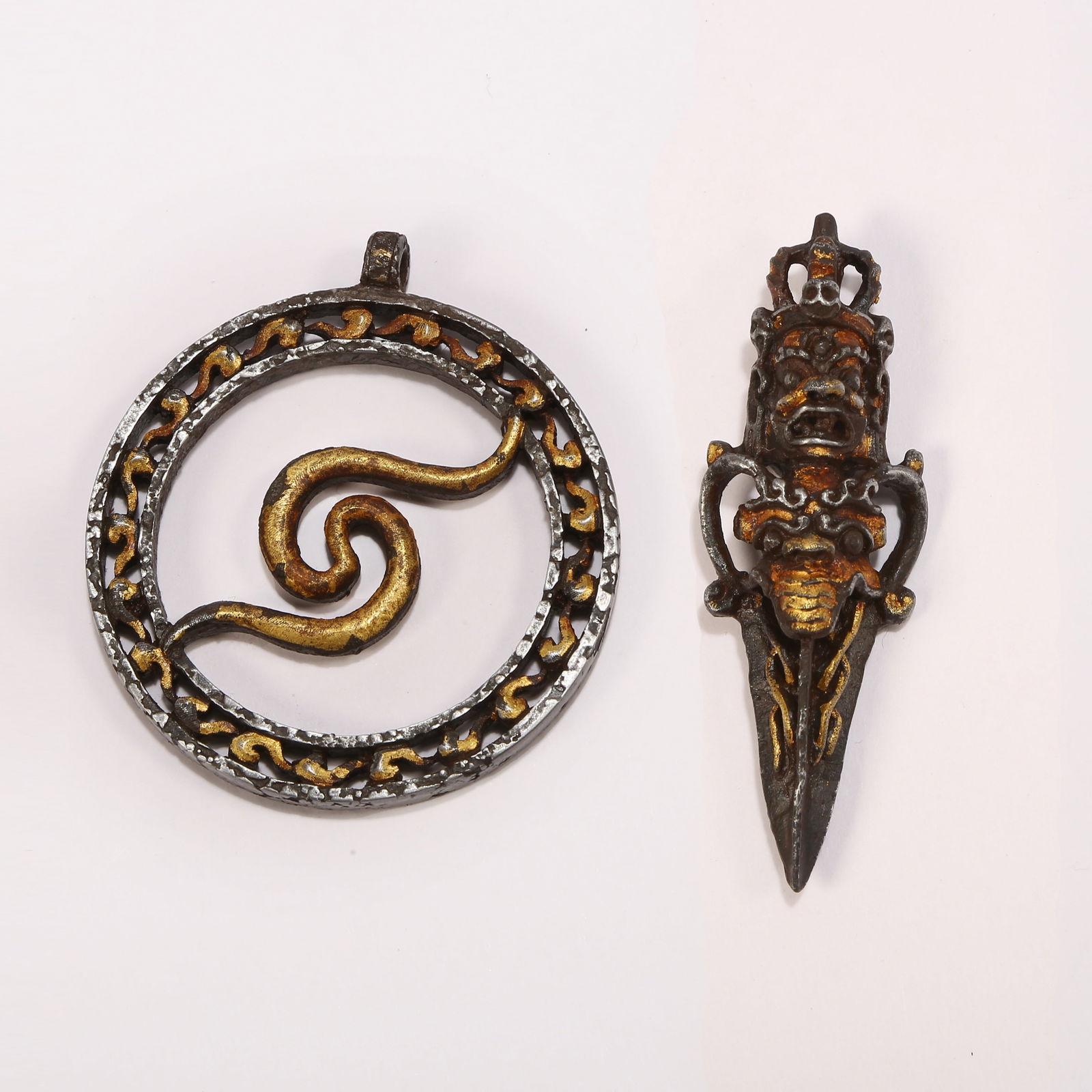 A SET OF IRON-AND-GILT PENDANTS (1 of 15)