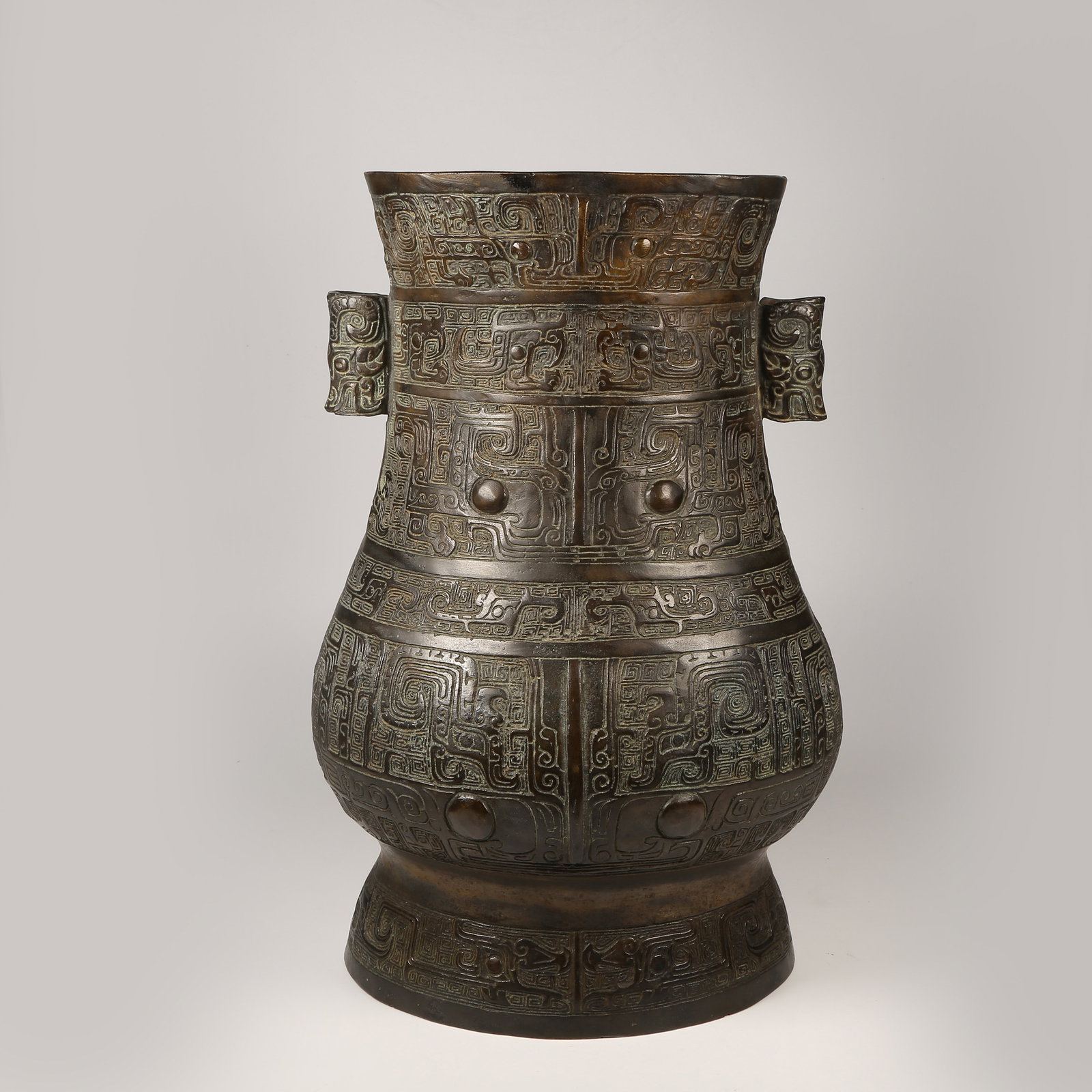 A BRONZE EWER WITH KUI-DRAGON MOTIFS AND ANIMAL-FORM HANDLES (1 of 10)