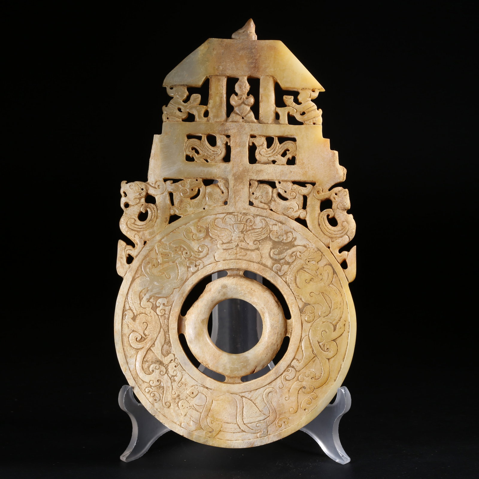 A ARCHAIC JADE DISC WITH FEATHERED FIGURE AND AUSPICIOUS BEAST MOTIF AND RAISED RIM (1 of 9)