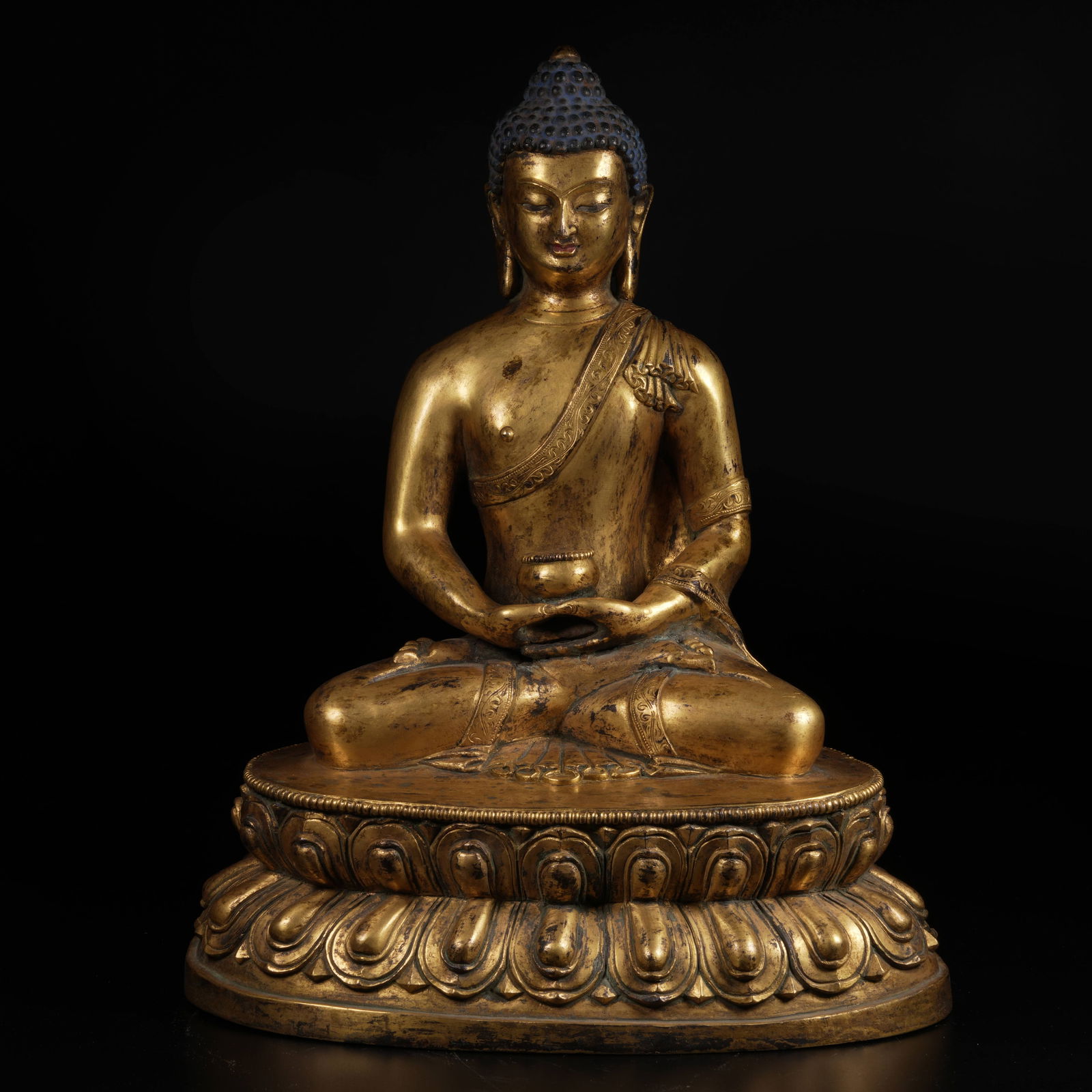 A GILT-BRONZE BHAISAJYAGURU (MEDICINE BUDDHA) STATUE (1 of 9)