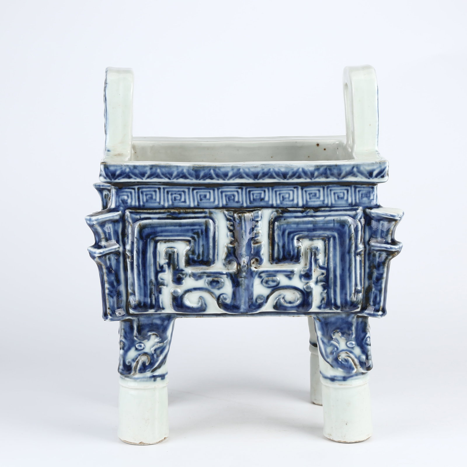 A BLUE-AND-WHITE BEAST FACE PATTERNED HALBERD-HANDLE DING (1 of 10)