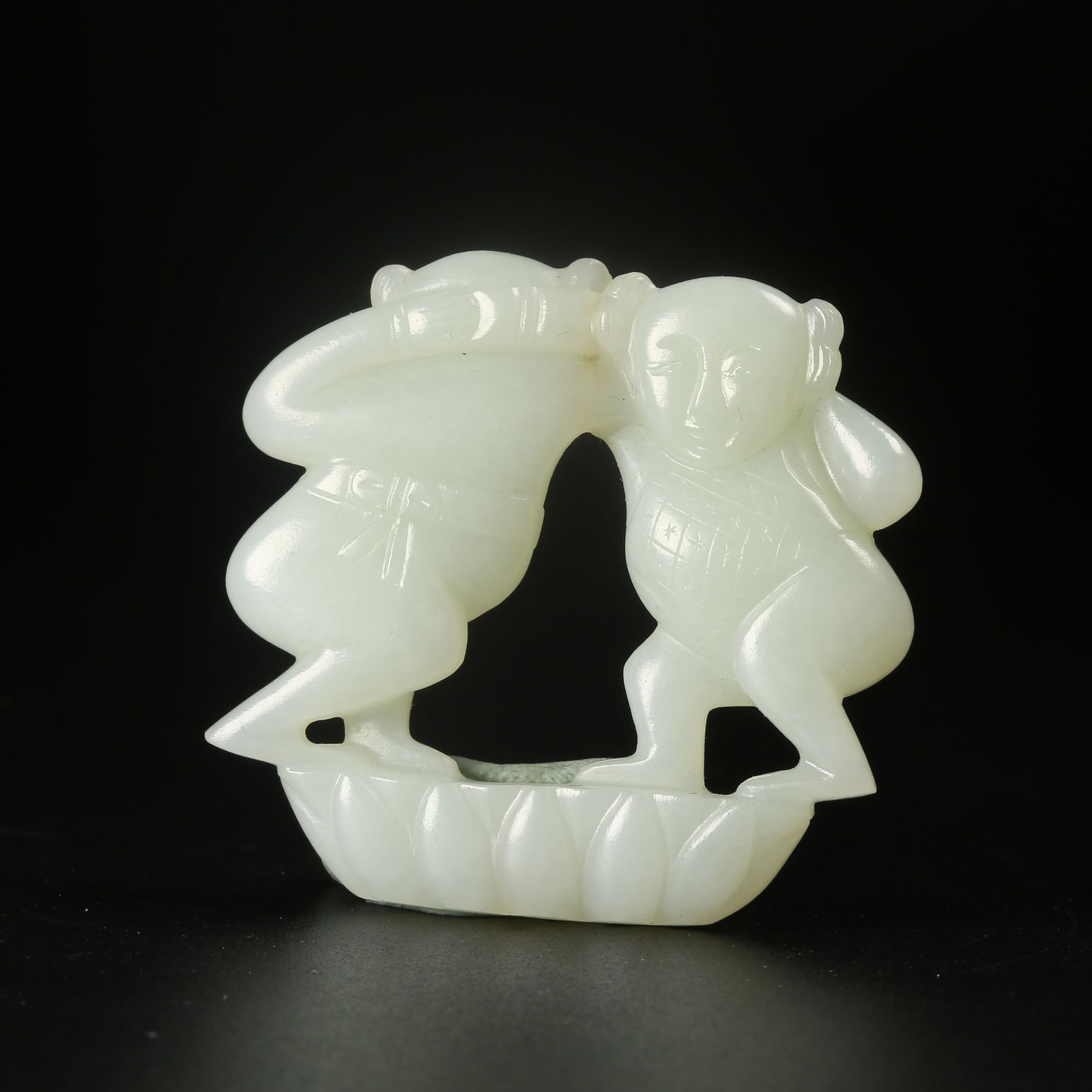 A HETIAN JADE CHILD FIGURINE: Hetian Jade Child Figurine