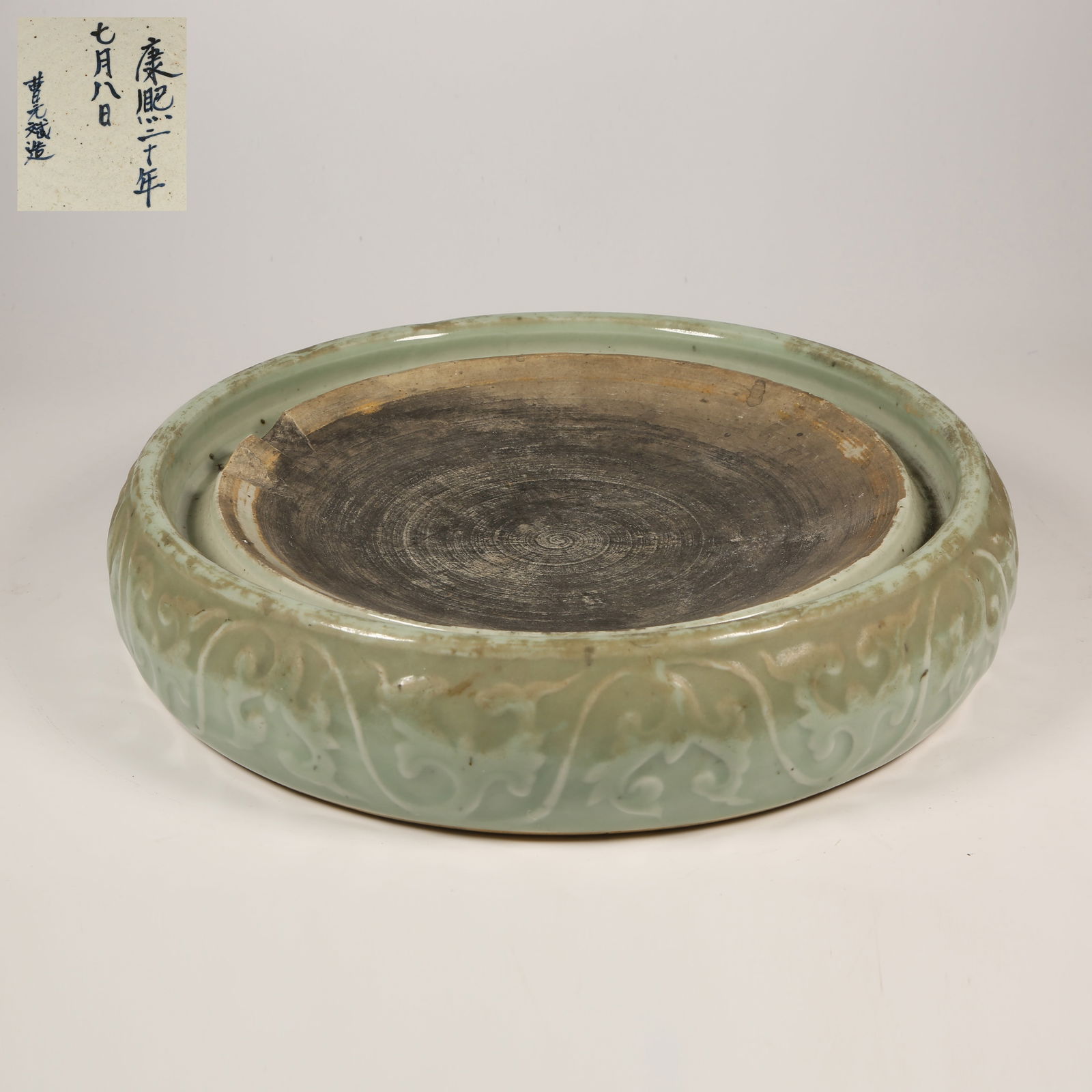 A CELADON GLAZED INKSTONE WITH PASSIONFLOWER MOTIFS (1 of 8)