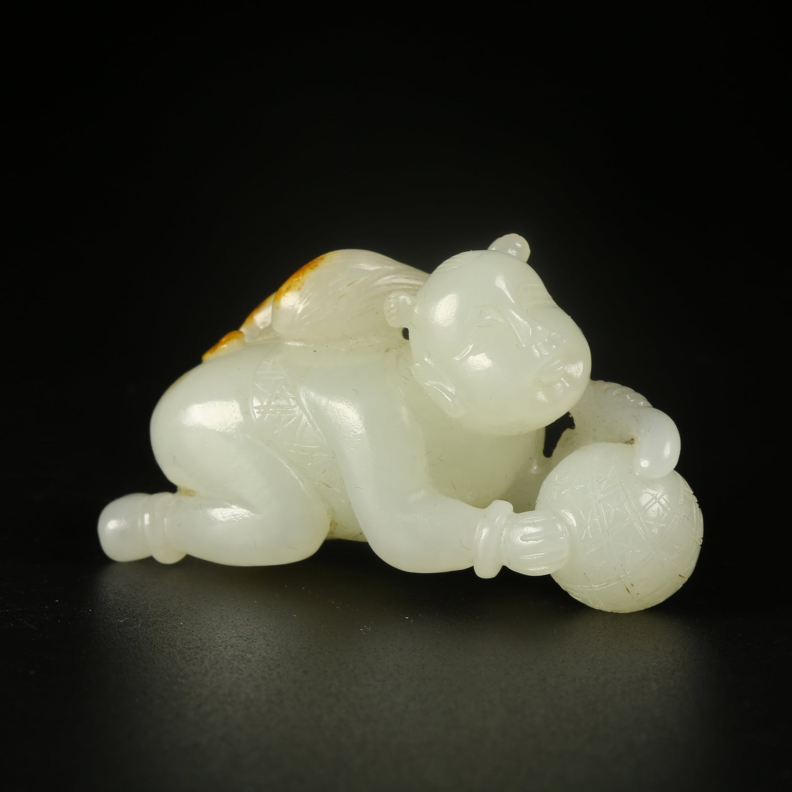 A HETIAN JADE LOTUS-LEAF CHILD (1 of 6)