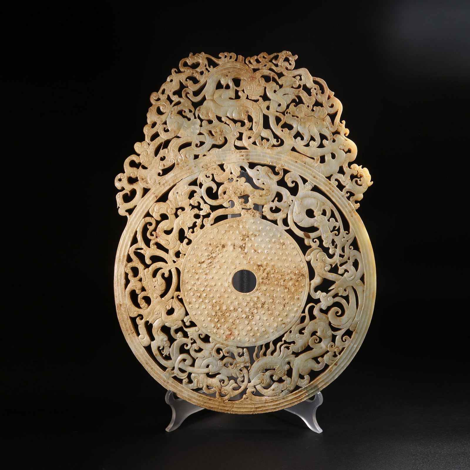 A ARCHAIC JADE RAISED-RIM DISC WITH DRAGON MOTIF (1 of 8)