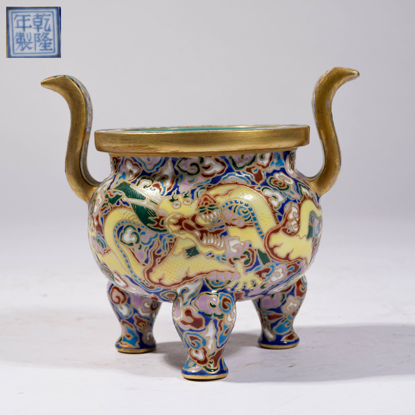 A FAMILLE ROSE CLOUD-AND-DRAGON PATTERN THREE-LEGGED CENSER WITH UPTURNED HANDLES (1 of 9)