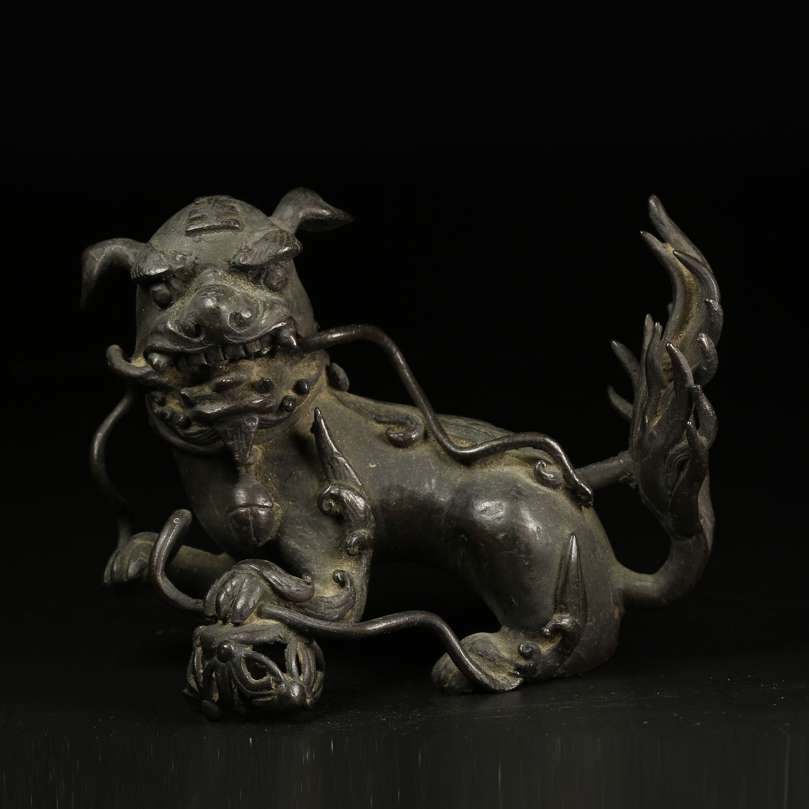 A BRONZE LION WITH EMBROIDERED BALL ORNAMENT (1 of 9)