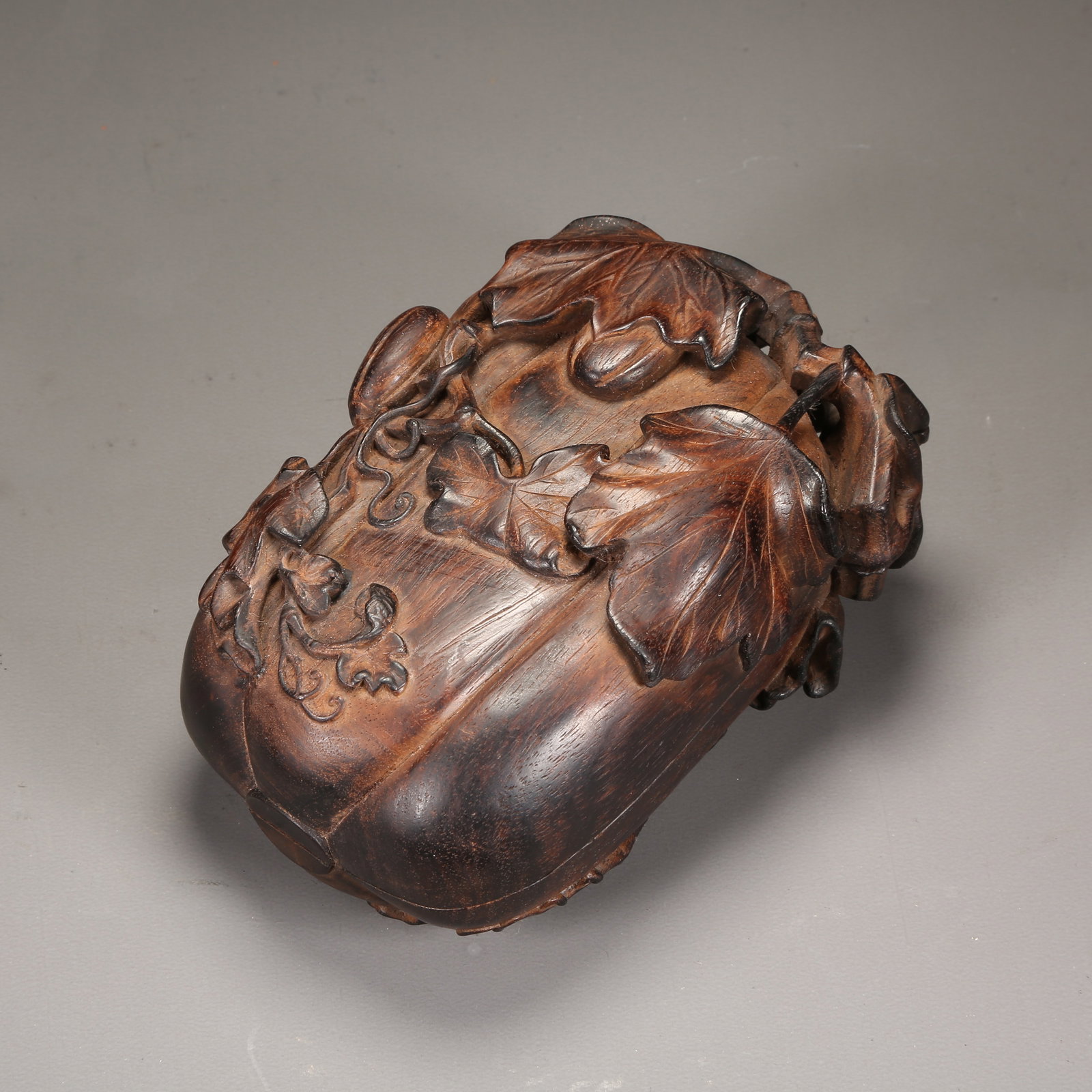 A ZITAN LIDDED BOX WITH MELON-VINE PATTERN: Zitan Lidded Box with Melon-Vine Pattern