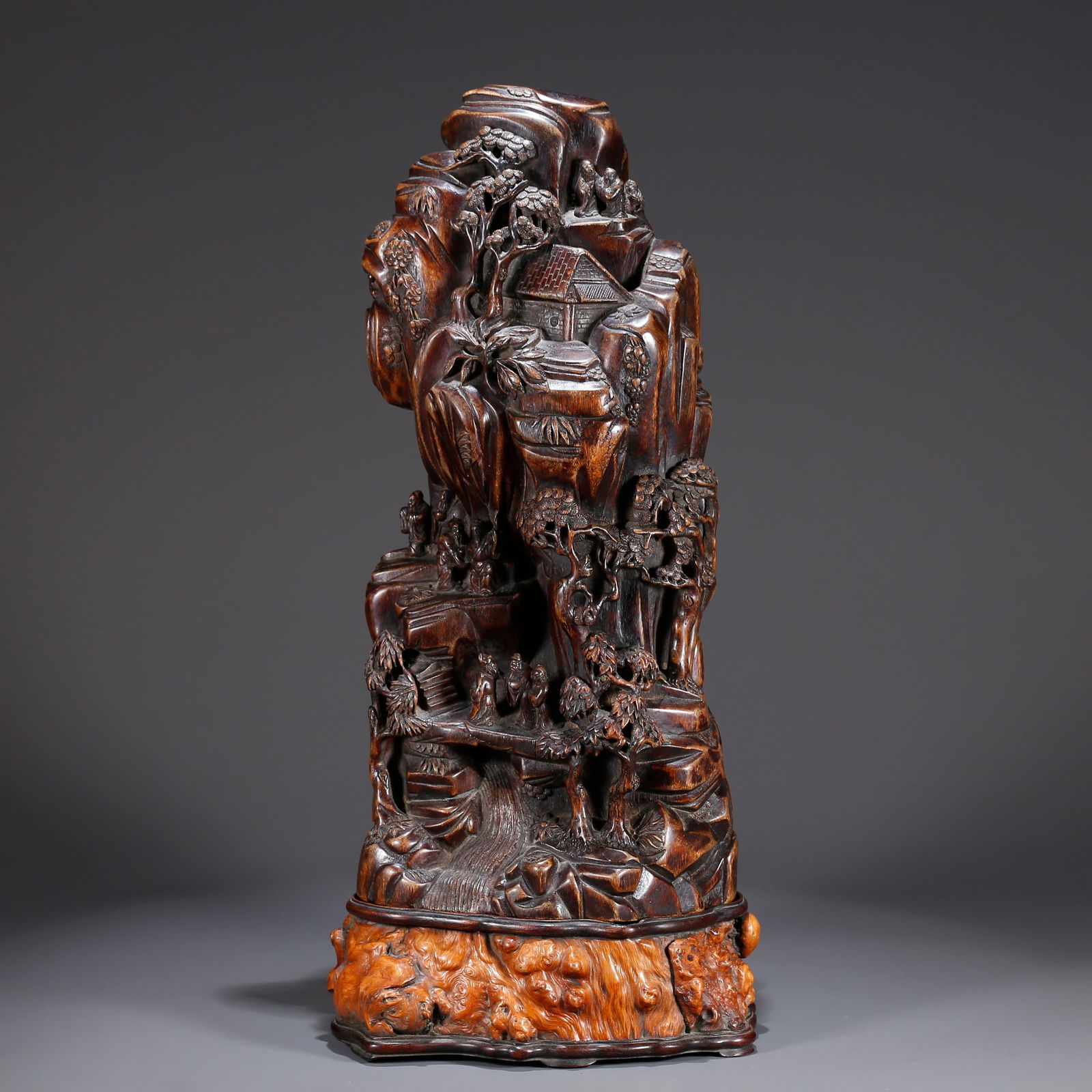A HUANGHUALI WOOD CARVING OF A FIGURE AND MOUNTAIN-SHAPED FIGURINE (1 of 8)