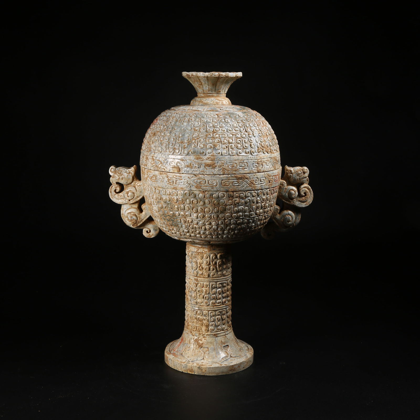 A ARCHAIC JADE DOU VESSEL WITH BEAST-SHAPED HANDLES: Archaic jade dou vessel with beast-shaped handles