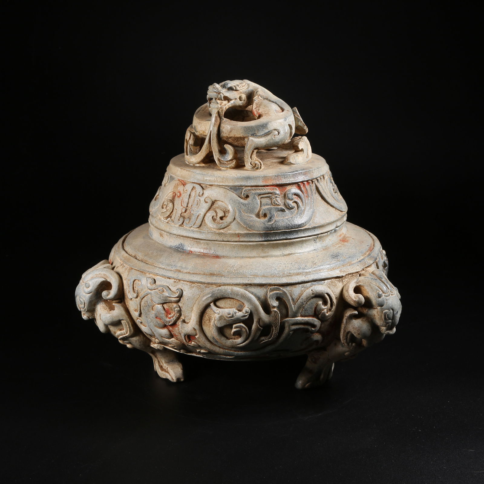 A ARCHAIC JADE TRIPOD CENSER WITH DRAGON MOTIFS: Archaic jade tripod censer with dragon motifs