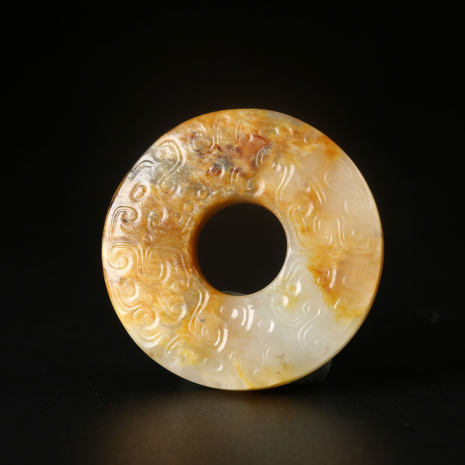A ARCHAIC JADE BI DISC WITH HOOKED-CLOUD MOTIF (1 of 8)