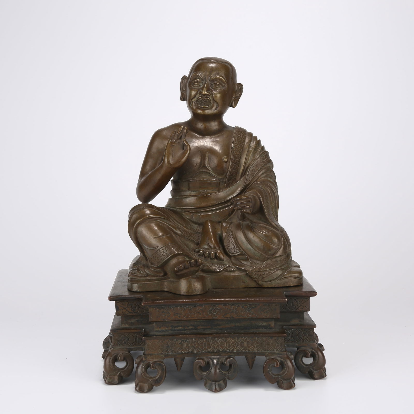 A SEATED BRONZE ARHAT STATUE (1 of 9)