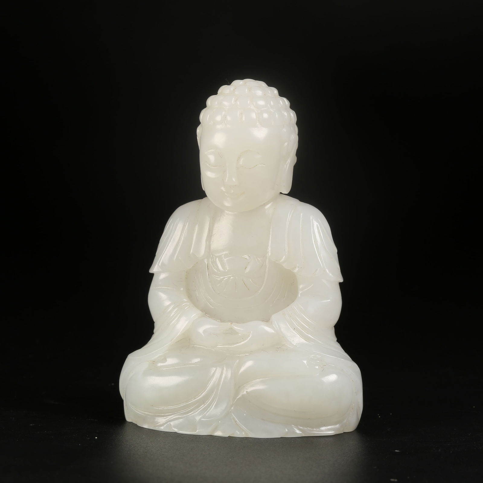 A HETIAN JADE SHAKYAMUNI SEATED STATUE: Hetian Jade Shakyamuni Seated Statue