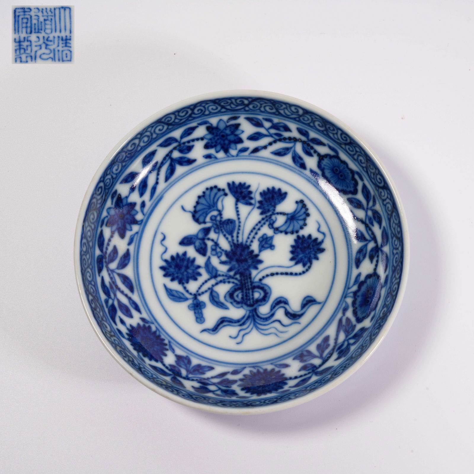 A BLUE-AND-WHITE DISH WITH INTERTWINING LOTUS SCROLL DESIGN (1 of 9)