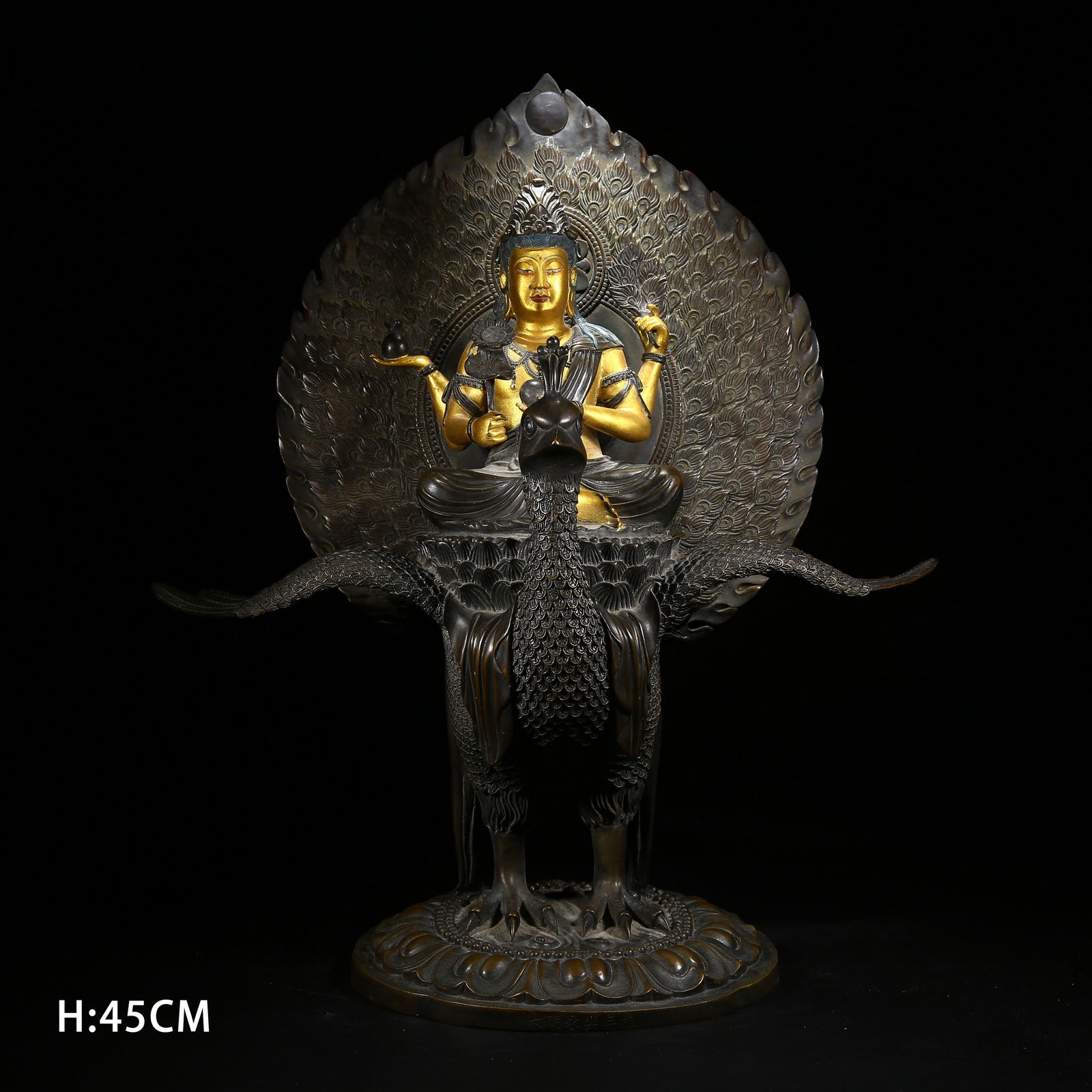 A GILDED BRONZE STATUE OF PEACOCK BUDDHA MOTHER: Gilded bronze statue of Peacock Buddha Mother