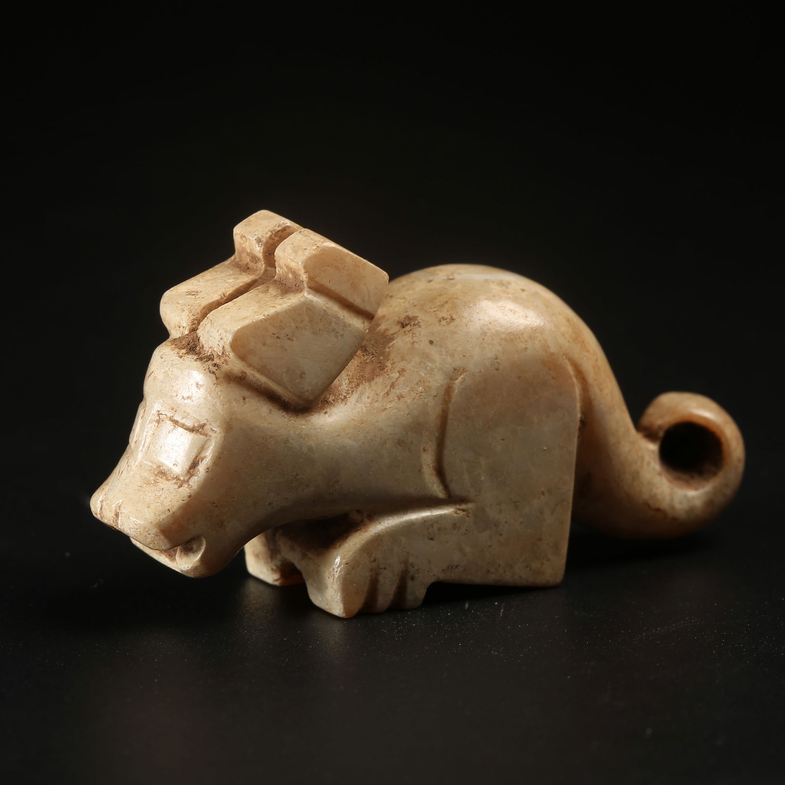A ARCHAIC JADE AUSPICIOUS BEAST FIGURINE (1 of 8)